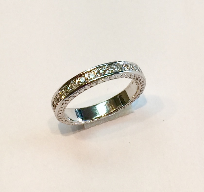 Item No AB30 USD 475 14K White Gold Diamond Band Approximately .26 carat of sparkling diamonds and nice filagree work along the sides. Classic quality Size US 4.875, has room for some small sizing. 
