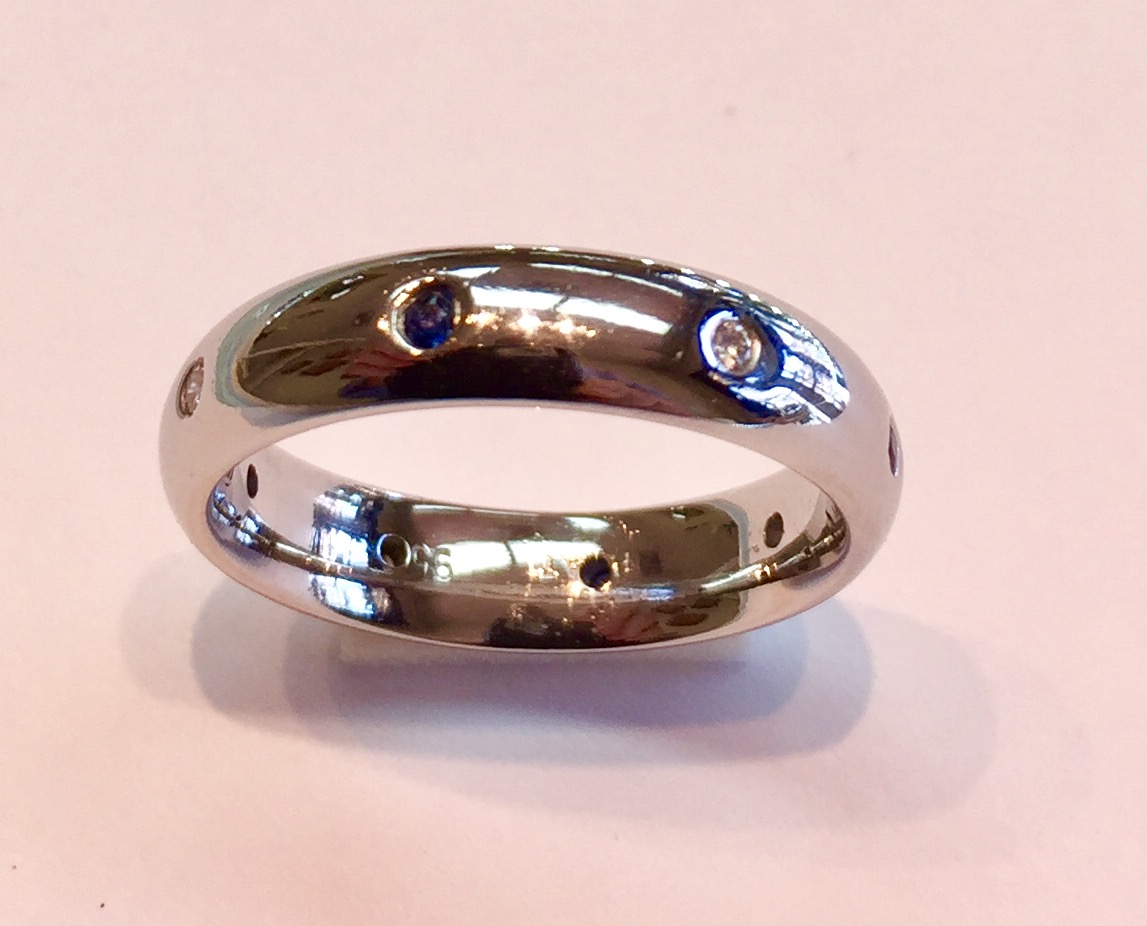 Item No AB84 USD875 Platinum Sapphire and Diamond Ring/Band A stunning high quality substantial ring with alternating blue sapphire and diamonds. Elegance, class and timelessness. Currently a US size 7.5 but can be sized. 10.1 grams