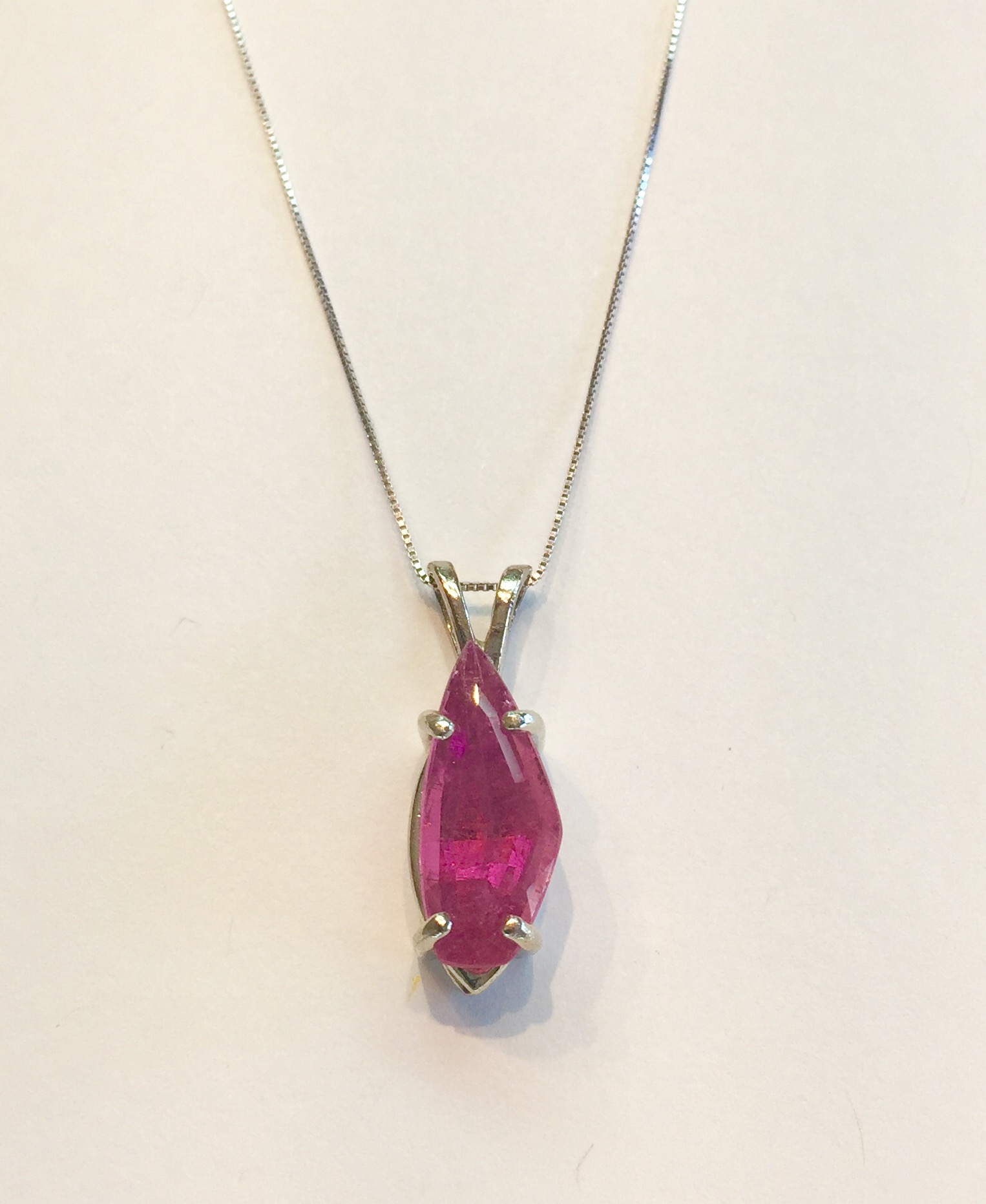 Item NoAB110 USD375 14k White Gold Pink Tourmaline Pendant/ Necklace Irregular cut on this charming pendant of approximately 3 carats of this sought after color of pink tourmaline. Originally cut directly by the miner for his own collection and now available to you at a great price. Another uniquely original piece. 