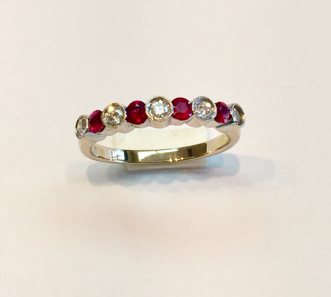 Item No AB163 USD845 18K White Gold Ruby Diamond Ring A quality ring with .5 carat of bezel set diamonds (with a tiny bit of millgrain) and really fabulous color on the .60 carat of rubies. Very nice indeed. 