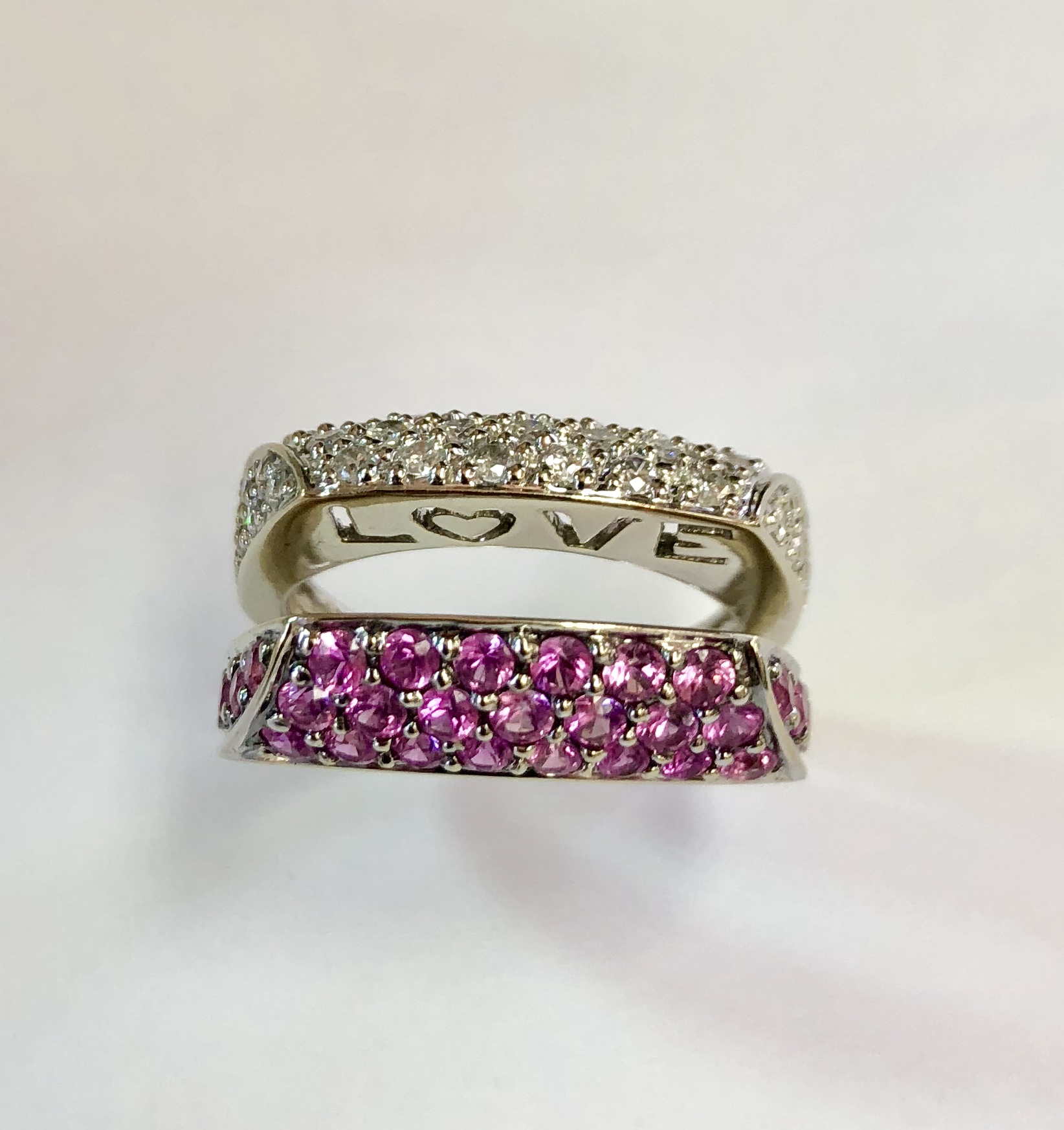 Item No A168 USD895 14K White Gold Pink Sapphire and Diamond Ring Another unique piece (or two pieces to be precise). Super quality and can be worn a few different ways. They look great together as shown in the first picture and they also look great when worn so that the words face you. What a gift ! 8.2 grams