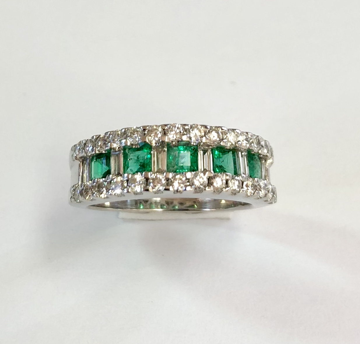 Item no. 388 US$825 Stamped 18k White Gold Emerald and Diamond Ring. Really beautiful ring with high quality sought after dark green square cut emeralds, approximately 1 carat, and spectacular baguette and round diamonds, approximately .8 carat, all set in luxurious white 18K gold. I find quality emeralds the hardest gemstone jewellery to find, lots of low quality but not so much high quality and when I do find it, it is usually very expensive. If you love this ring do not miss this opportunity. 5.5 grams