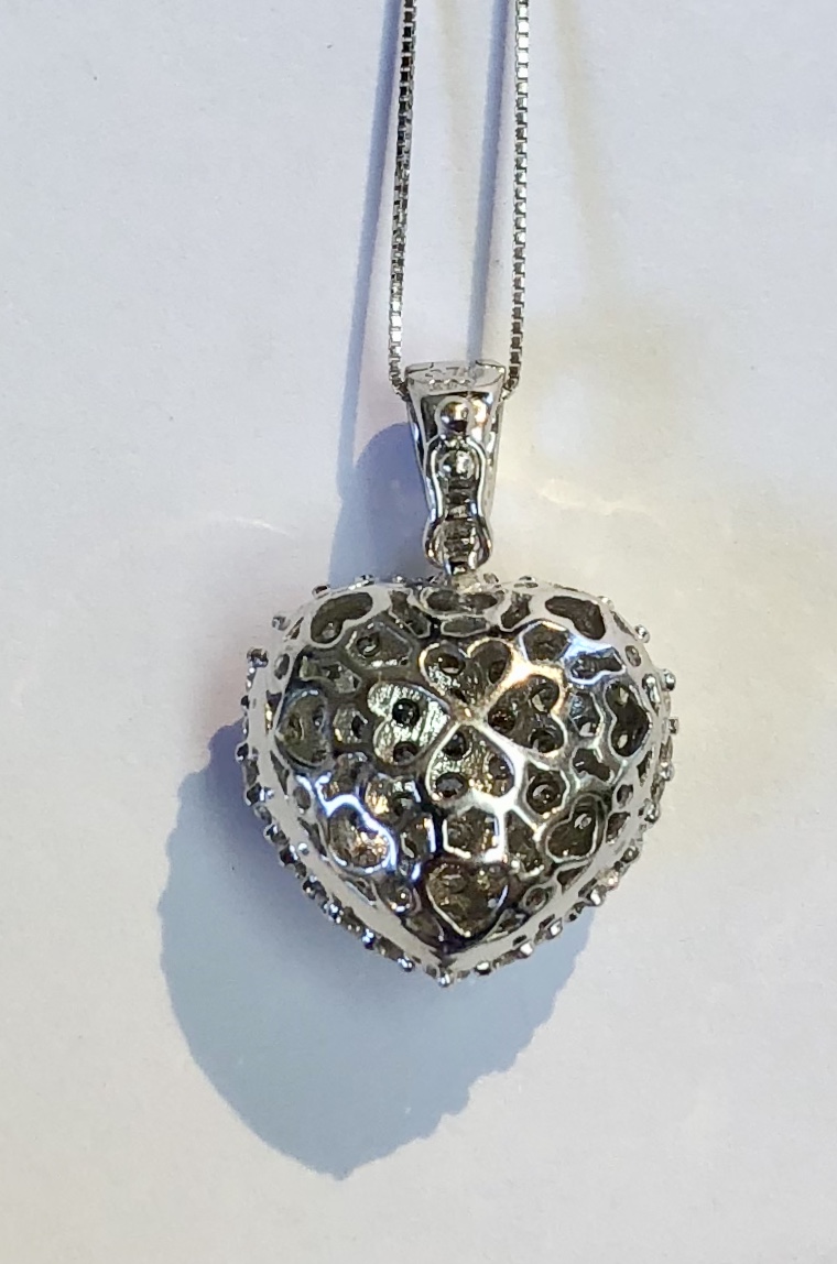 Item A 167 USD795 14K White Gold Diamond Necklace Approximately a carat of lovely diamonds in this heart puffed necklace. Not to big, not to small, just perfect. A fine example of a popular piece of jewelry. Classic, elegant and timeless 