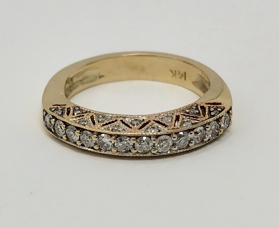 Item AC 107 USD625 14k Yellow Gold Diamond Band Great milgrain workmanship on this lovely band, with approximately .47 carat of quality diamonds on the top and the sides.