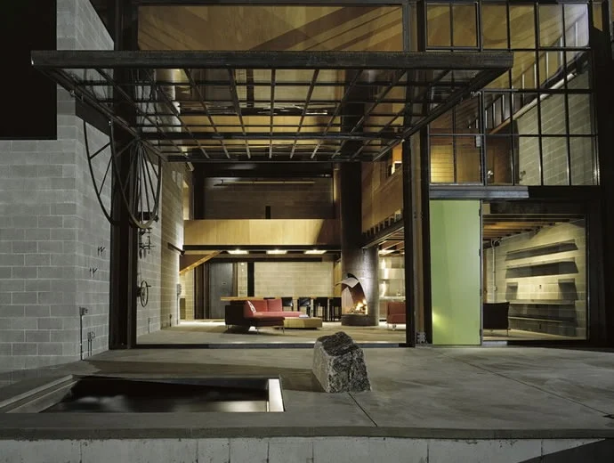 between-the-ears:

If you haven’t caught on yet, large openings and “garage doors” within the house is really catching on.  This is one of the coolest ones I’ve seen.  The industrial opening detail is where it is at…
Beautiful Houses: Chicken Point …