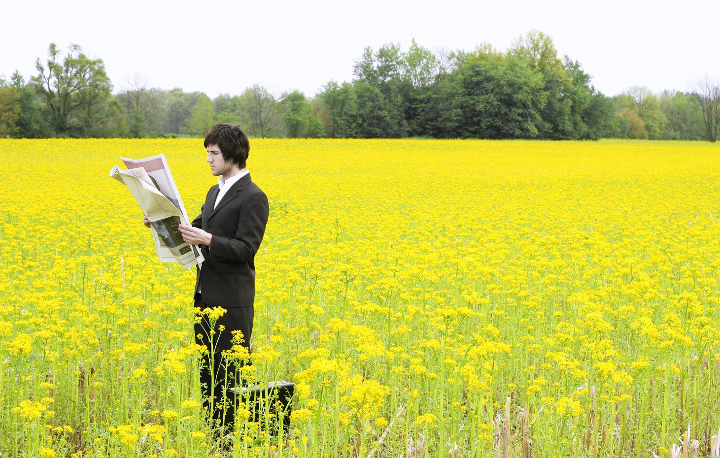 man reading newspaper
