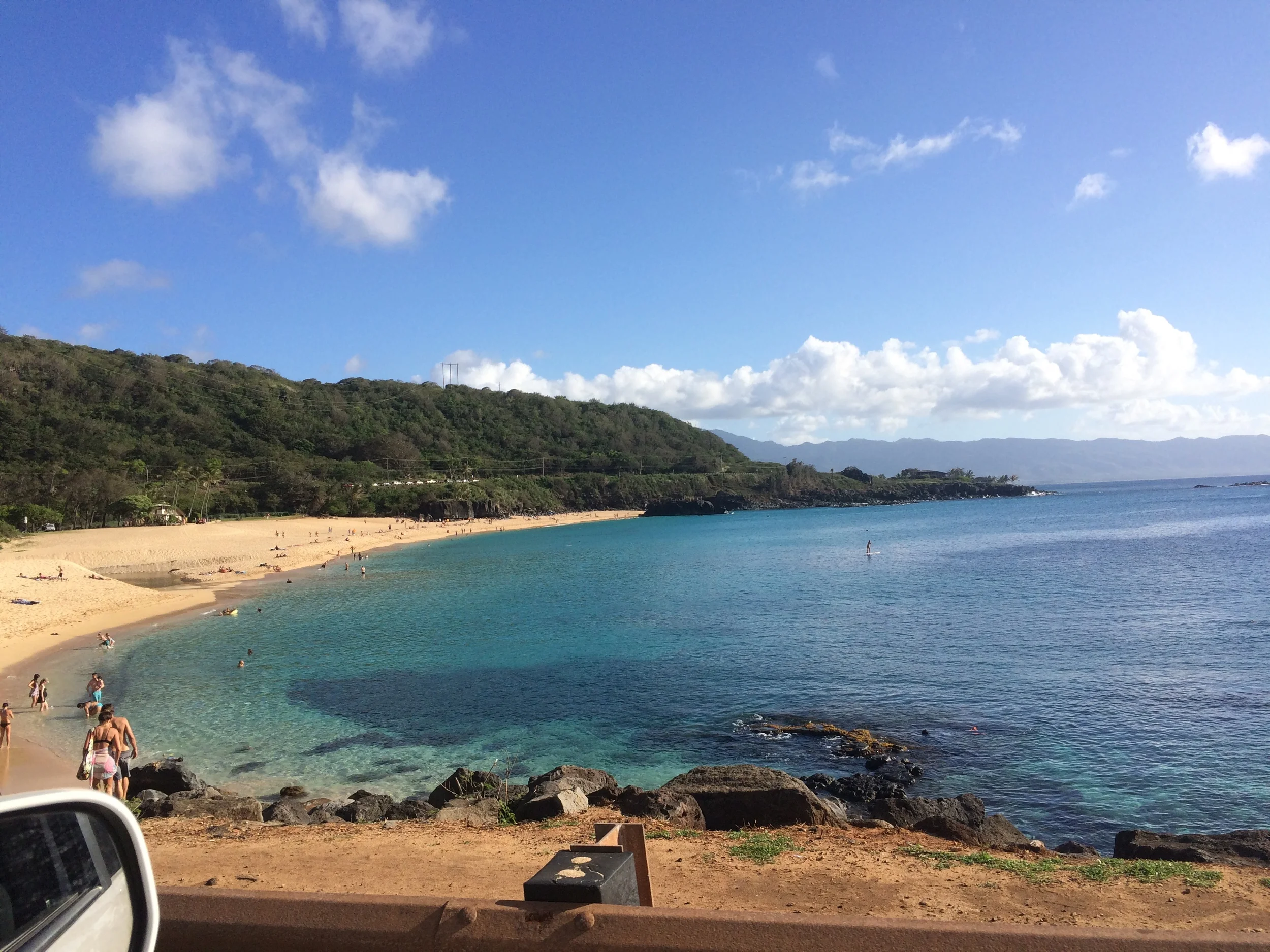 EDIT: For those unfamiliar with surf and Hawaii, I took this drive-by photo yesterday as we were passing Waimea Bay where the Eddie took place this past winter—such a stark difference, eh? The water was it's typical summer-pancake-like-self :) AND what a beautiful day, I must add. Look at those colors! 