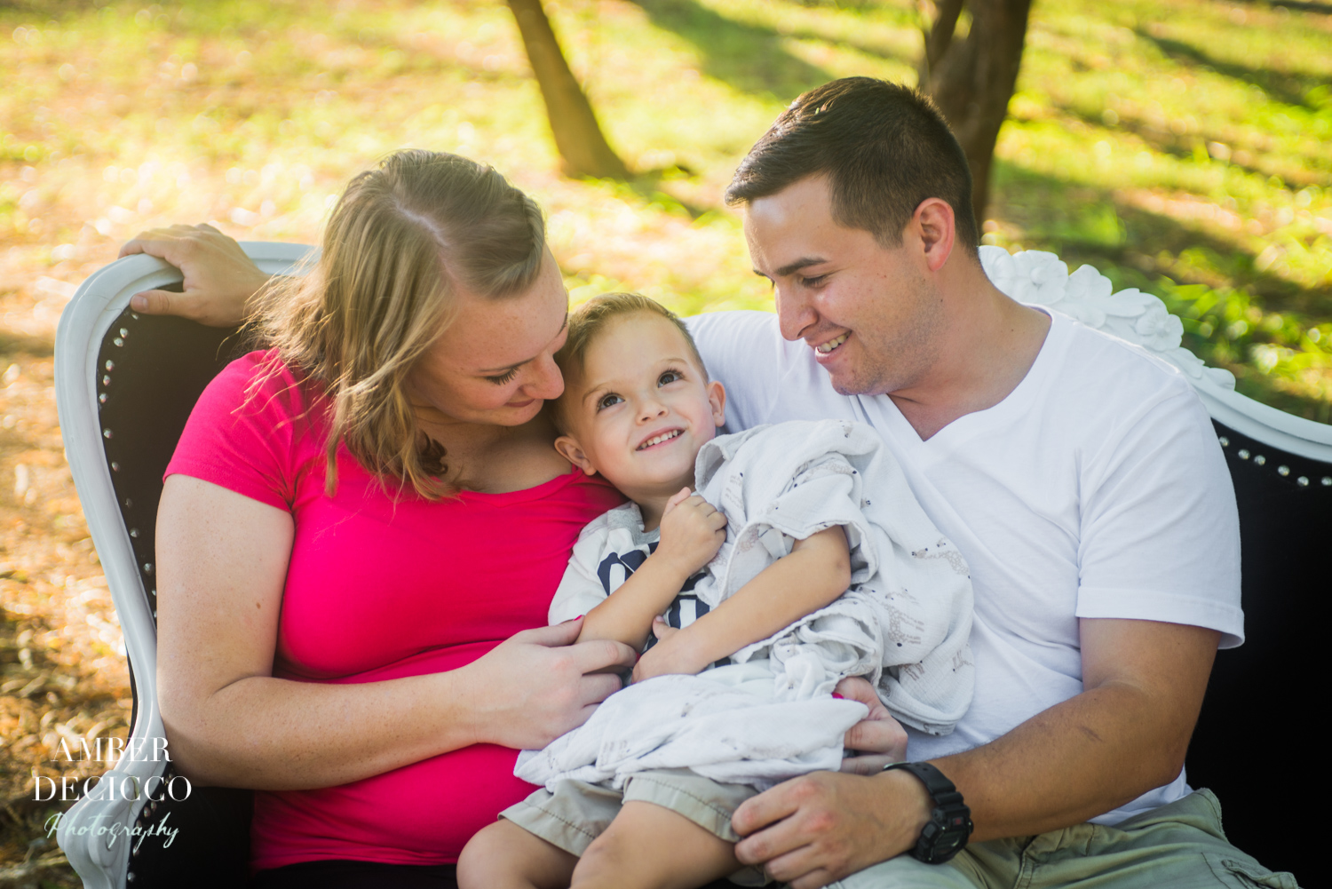 family-photographer-oahu-mom-dad-son-smiling.jpg