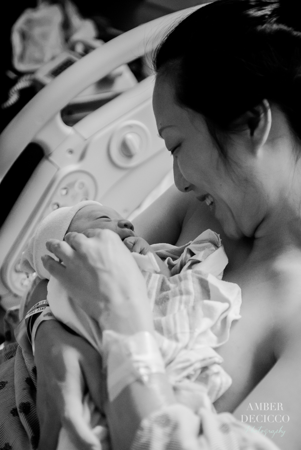 Mom admiring her baby | Birth Photography ©Amber DeCicco Photography