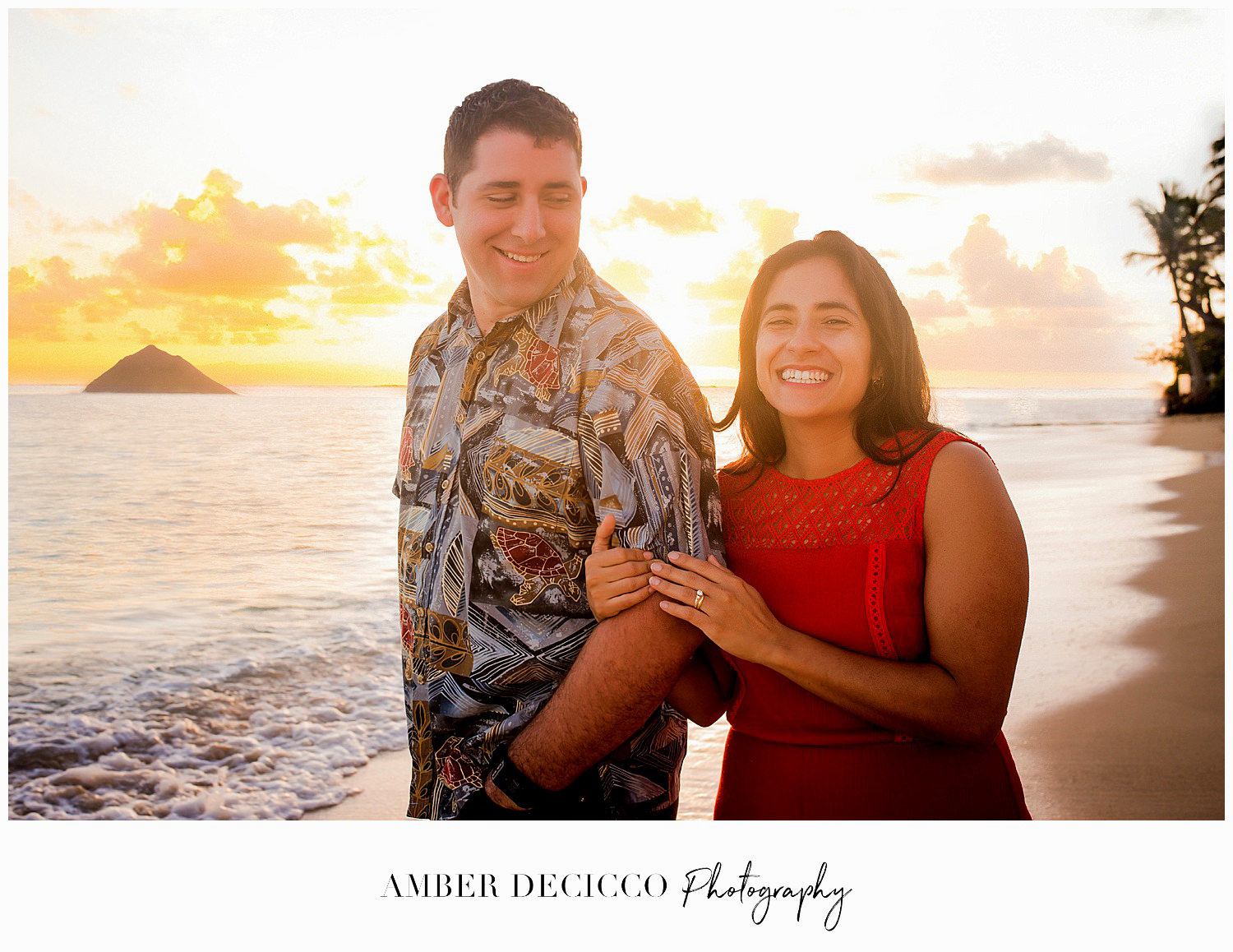 Engaged couple at sunset on Lanikai Beach