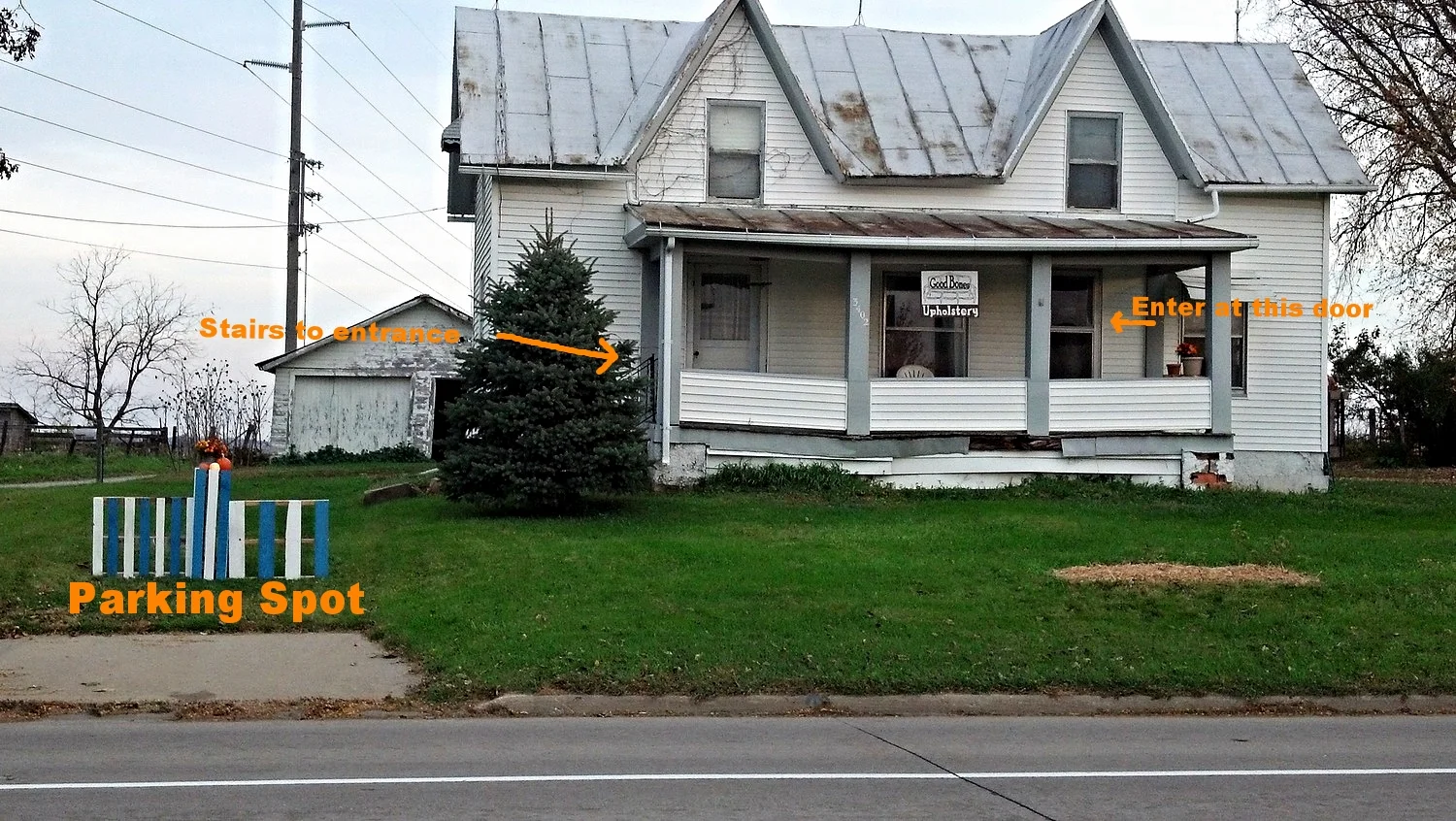 The Good Bones House.  I created the decorative fence piece in front of the parking pad out of recycled wood pallets. 