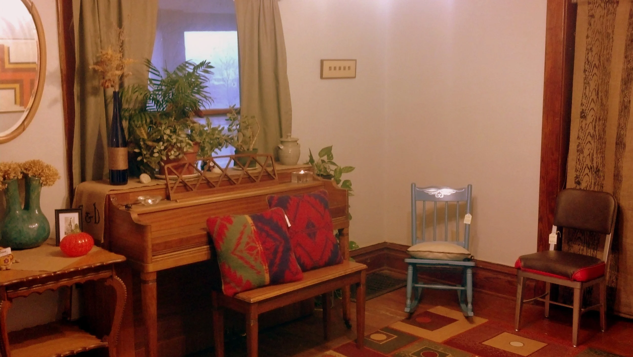 The studio consists of two rooms - a show room and a work room.  This is one side of the show room where I have my current finished pieces for sale. This space moonlights as a dining room outside of regular work hours. 