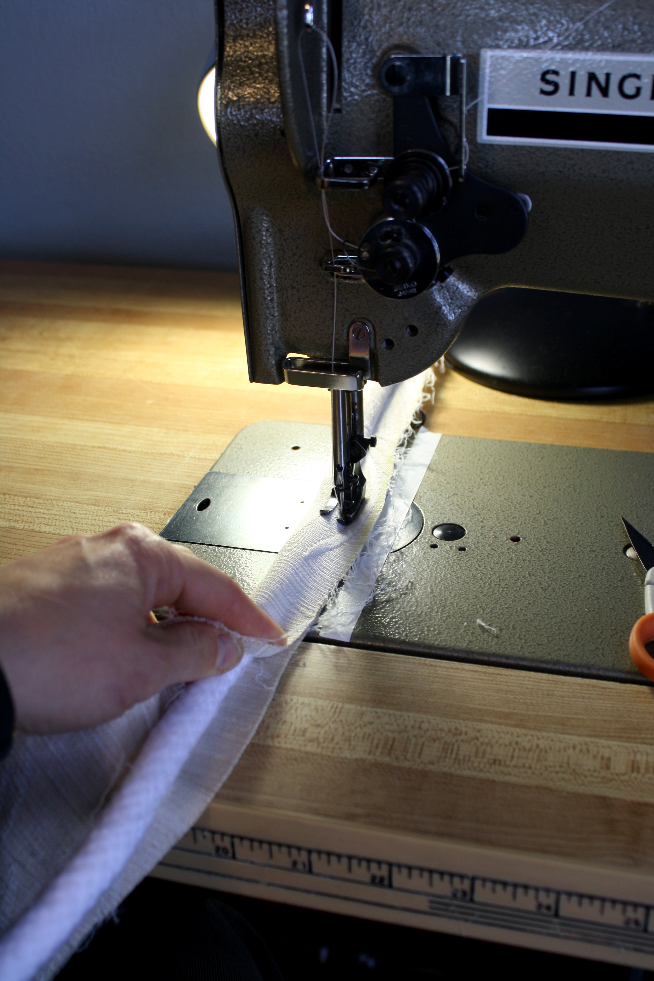  I used a specialty foot for my machine to sew the larger welting. The basic process is to cut strips of fabric into which the cording is sewn. &nbsp;A welting foot for the sewing machine assists in ensuring that the cording is sewn into the fabric s