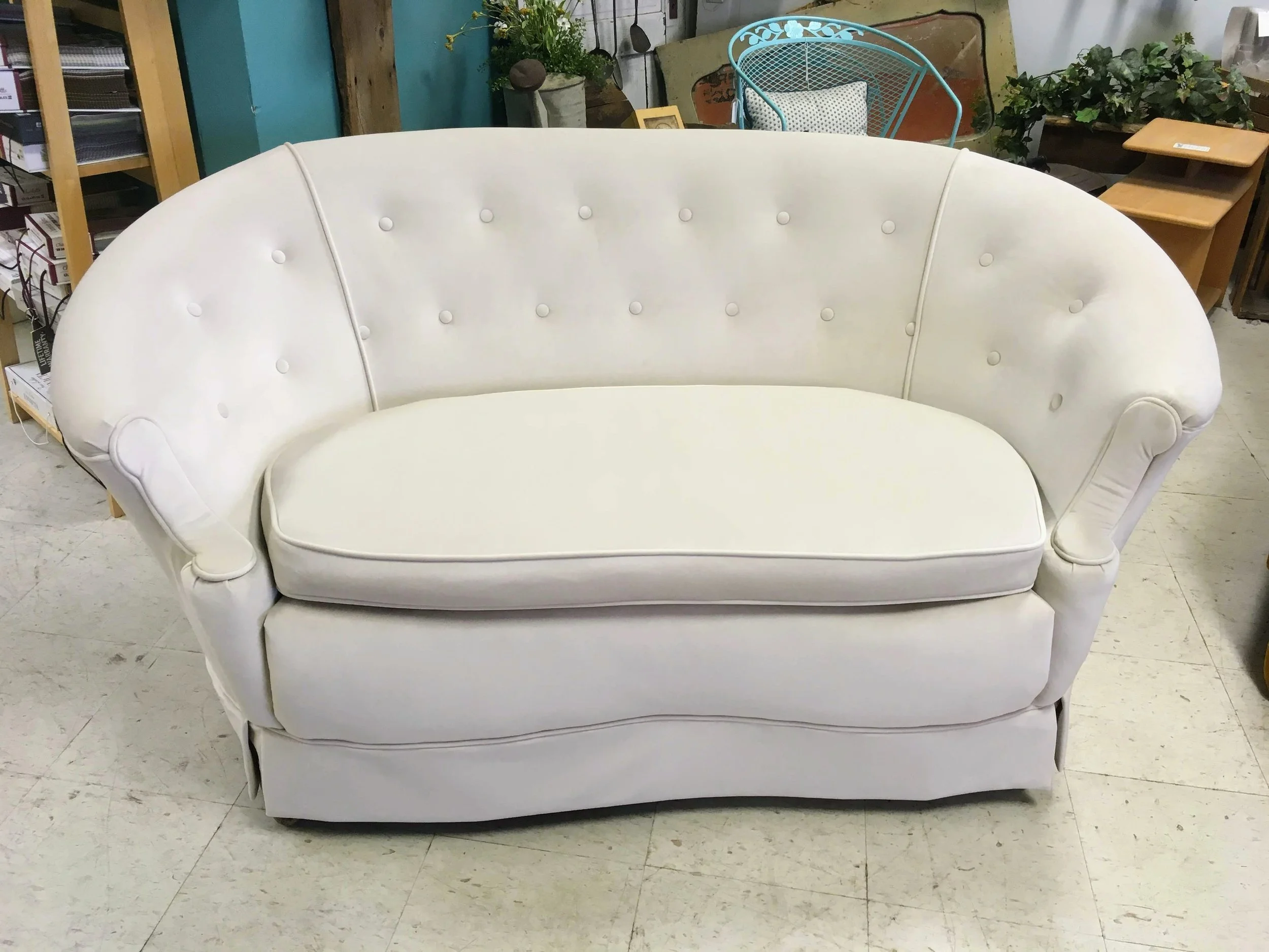 curved settee with button back