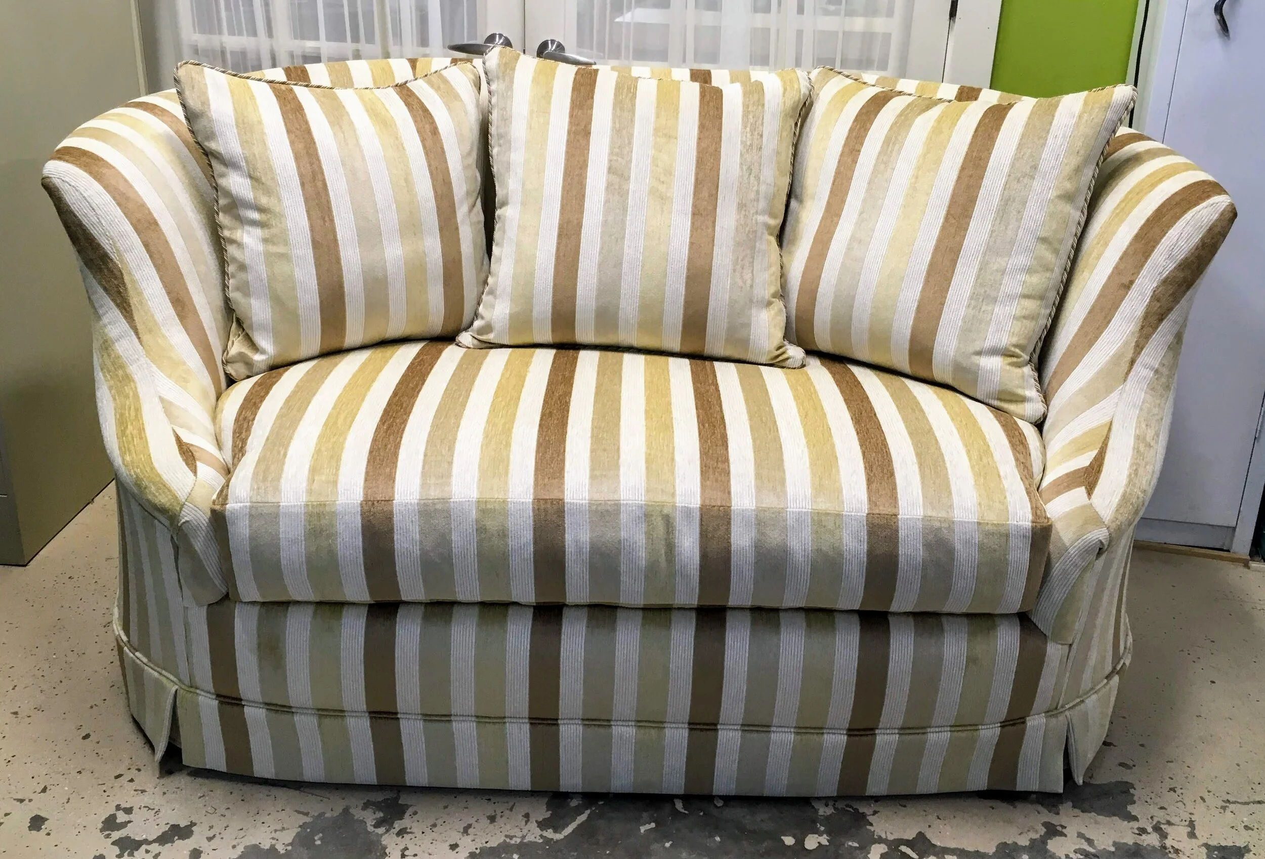 high-backed curved settee