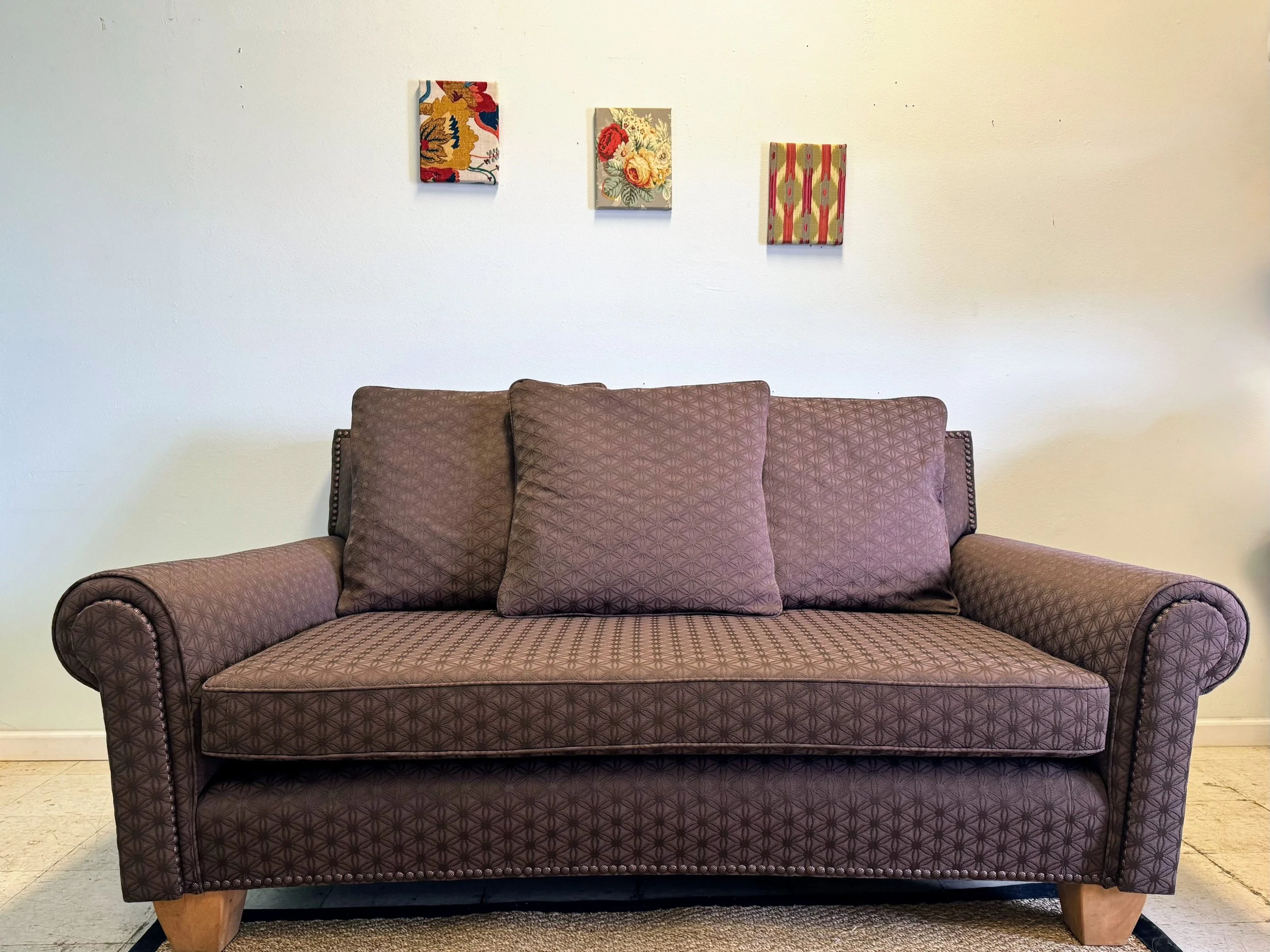 large loveseat with decorative nailhead trim