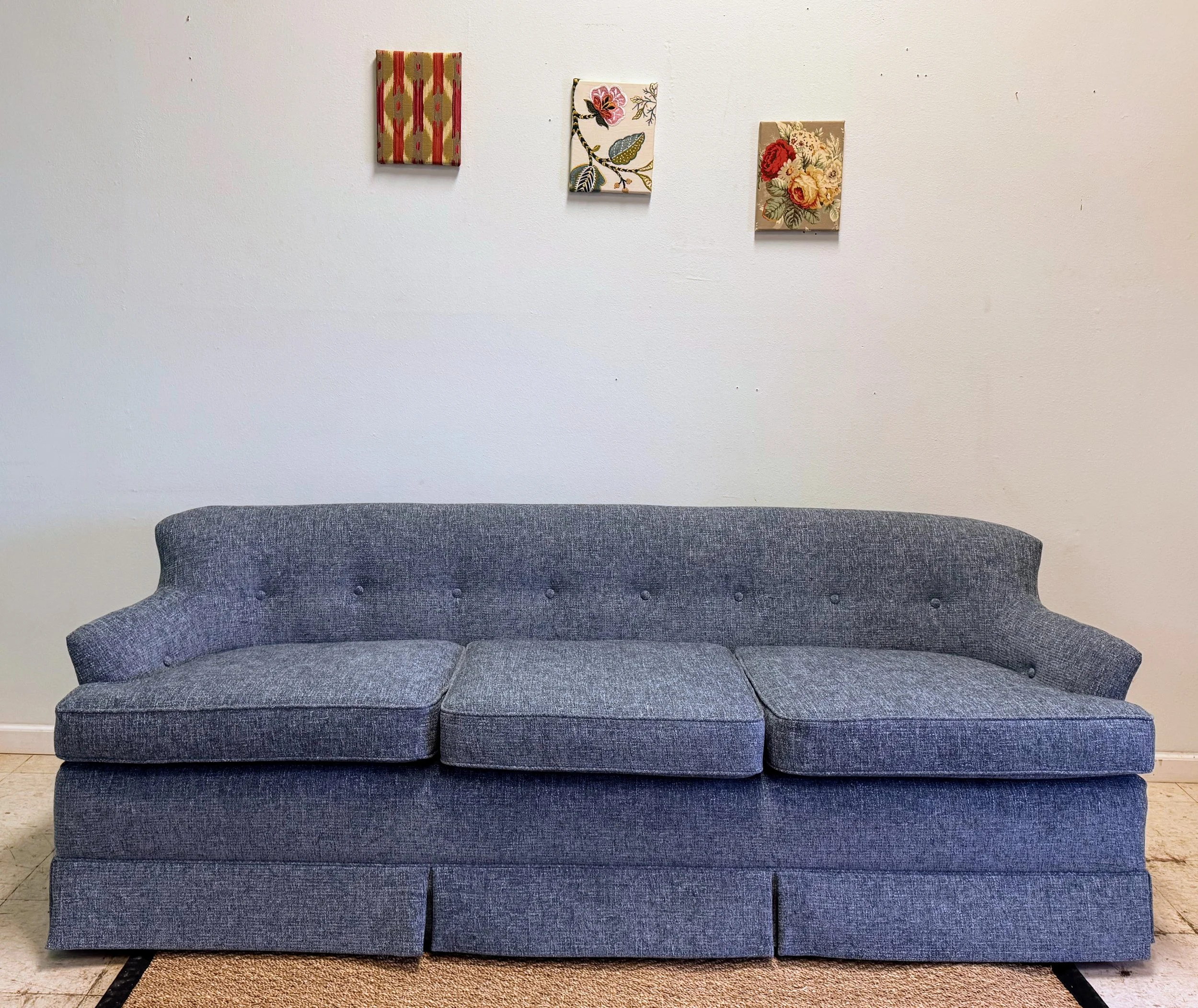 Winged sofa with skirts