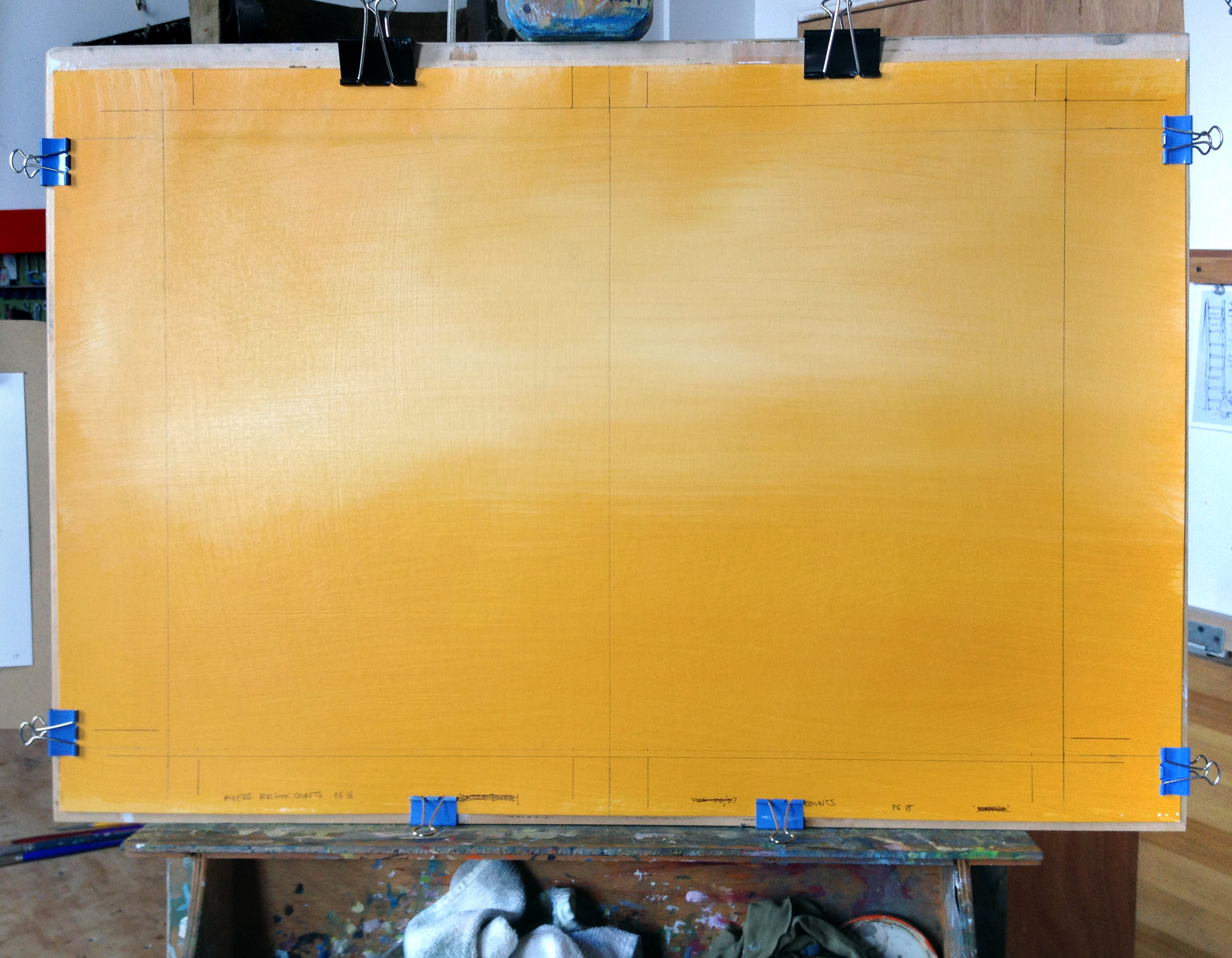 The board is clipped to plywood to keep it steady. The border indicates where the image will be trimmed for the book. I work about 120% of actual book size because art usually looks better when it's reduced.