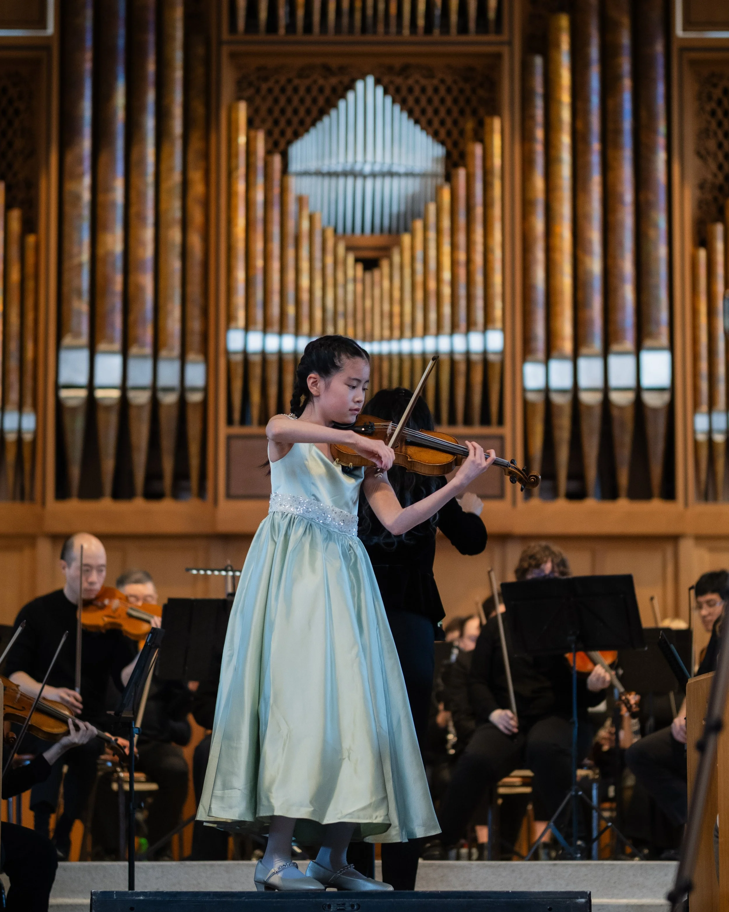 Lin Tokura plays solo violin with the Seattle Festival Orchestra