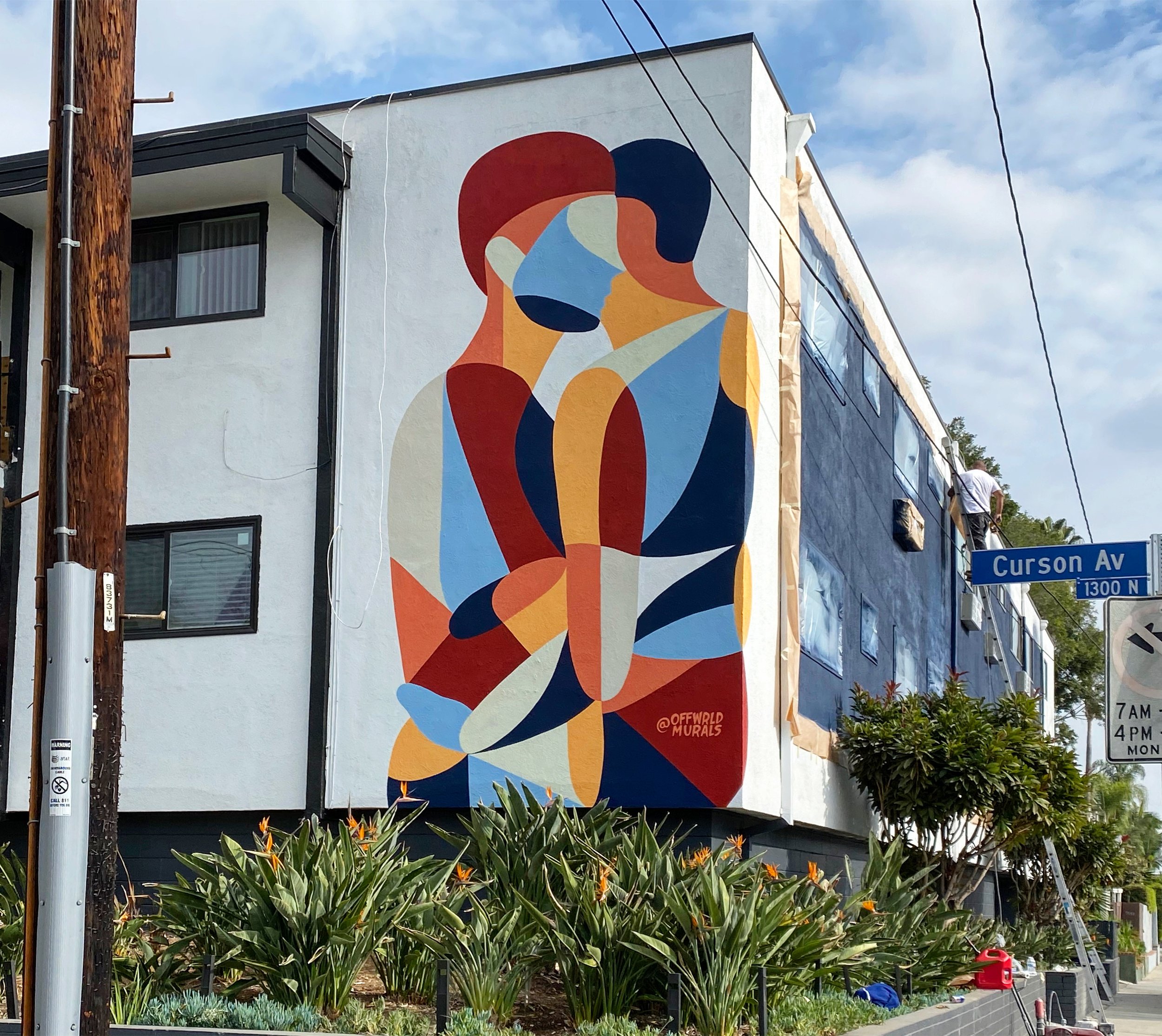  This mural features 2 abstract figures embracing. It was designed to celebrate the LGBTQ+ community of West Hollywood.  Coco Nella Collab with Offwrld Murals - Designed by Corinne Pulsinelle.   Location: West Hollywood, Los Angeles, CA. 