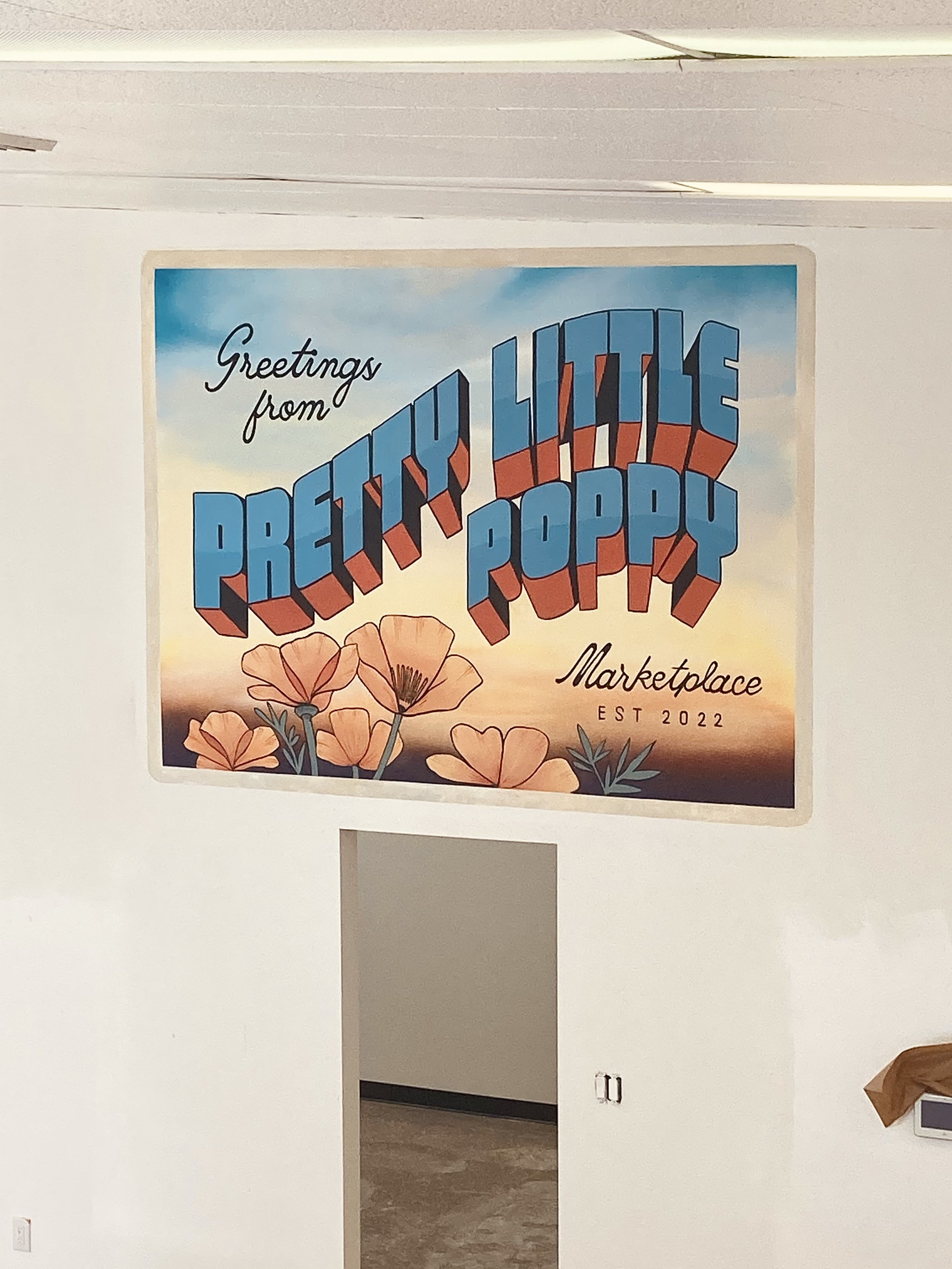  Postcard mural design for Pretty Little Poppy marketplace. This mural depicts large lettering with a classic postcard look.  Client: Pretty Little Poppy Retail Store  Location: Lancaster, Antelope Valley, CA 