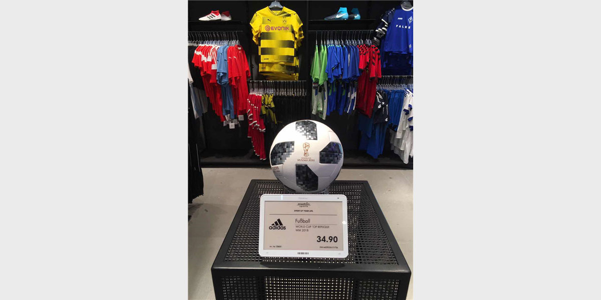 Large electronic price tag used to display pricing in a sports clothing store
