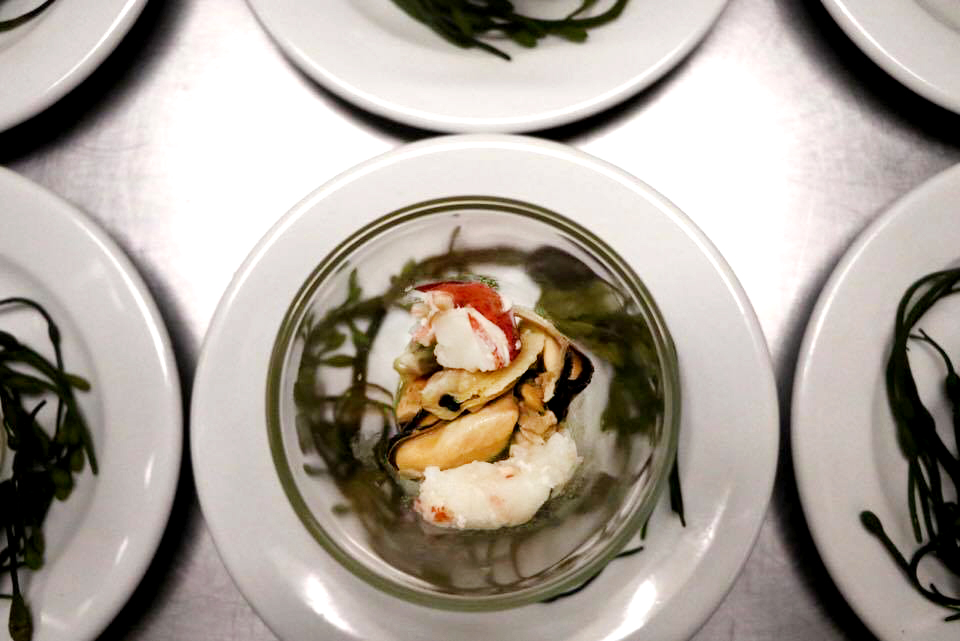 First course: Lobster, clams, mussels, tomato broth and sea urchin butter. Paired with Andalucia's Garden Edible Fragrance. Photo by Lindsay Taylor