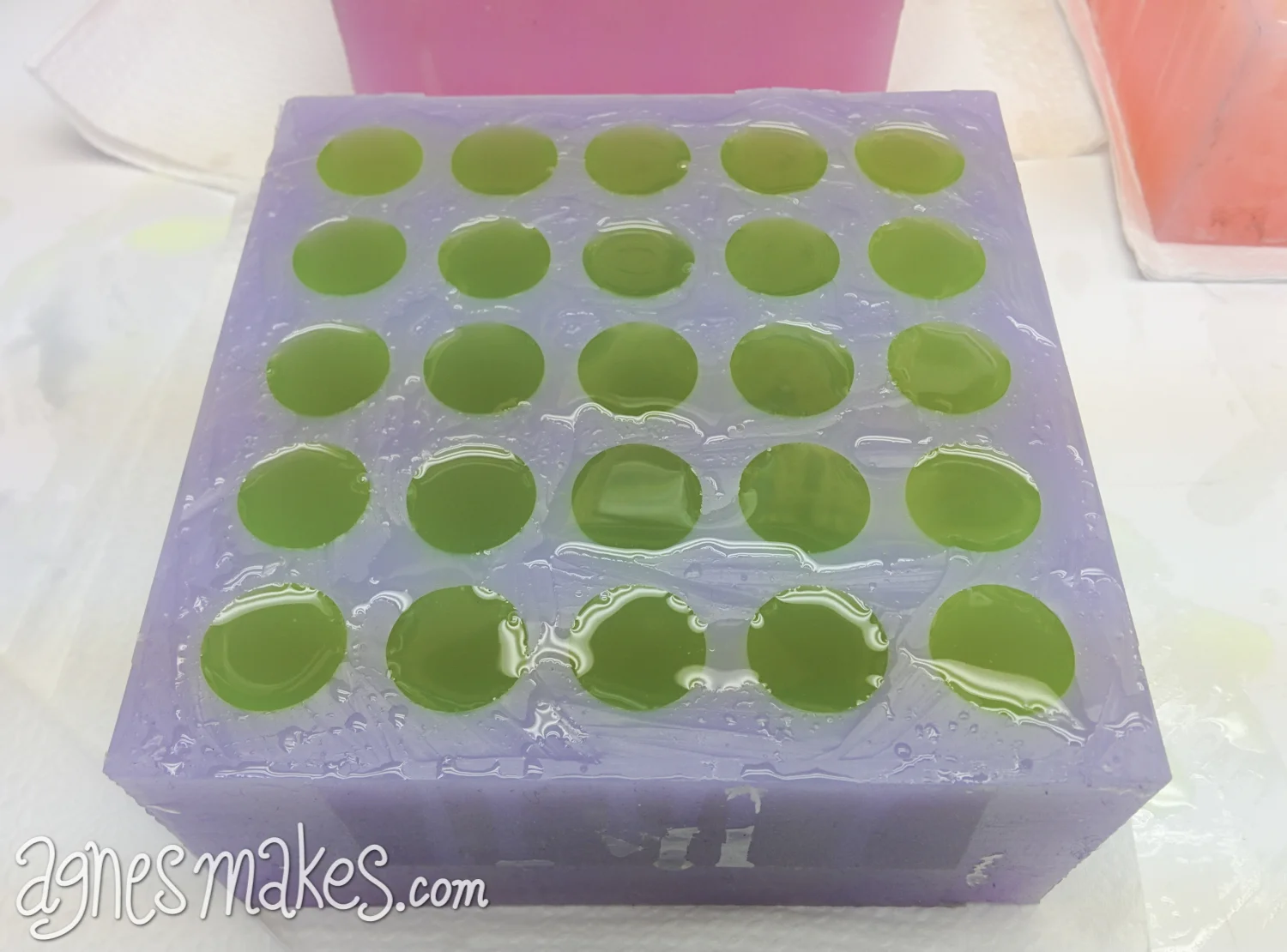 I found that by over filling the mold a bit and creating a thin consistent layer across the whole top of the mold made it easier when demolding. I was able to peel back that top layer of cured resin and clean the mold quickly. If I didn't do this step, I would end up with tiny puddles of over spill which are pretty sharp and annoying to clean from the mold once cured. This photo is a good example of the small puddles that are difficult to clean.