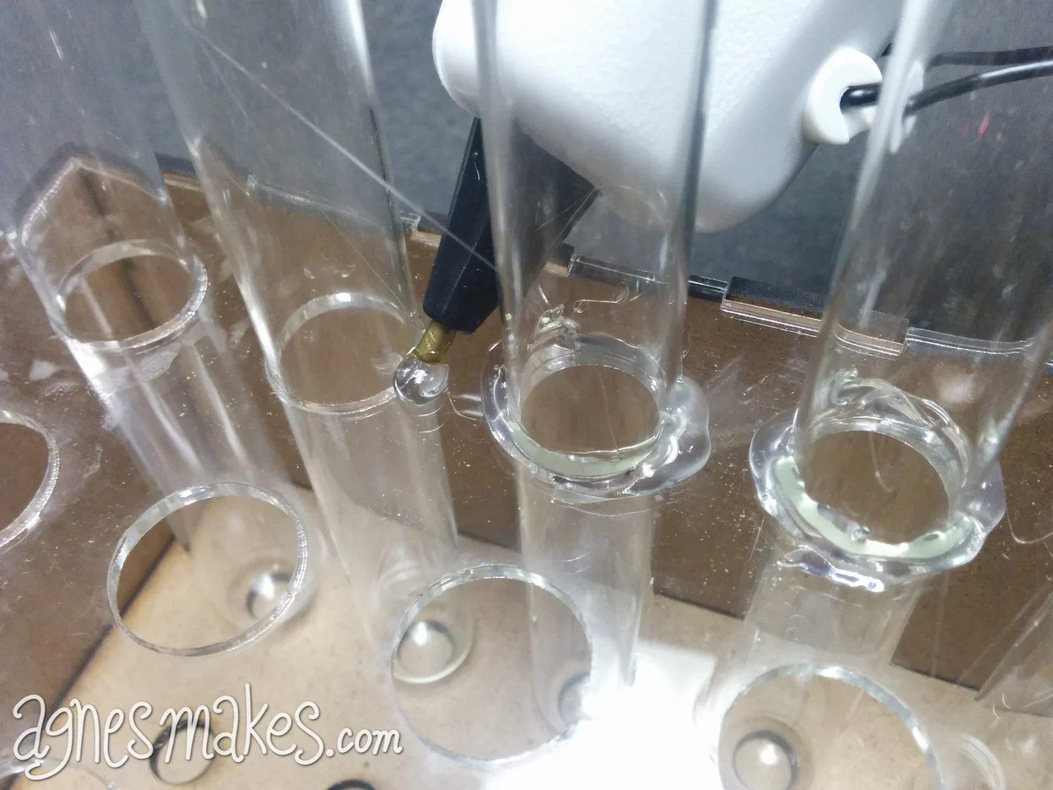 I forgot to photograph this step on the mold I have been showing you, so what you are seeing is an earlier attempt at the same thing. I used an acrylic face for the top aligning layer in this case. I'm using a bit of hot glue around each tube to sec