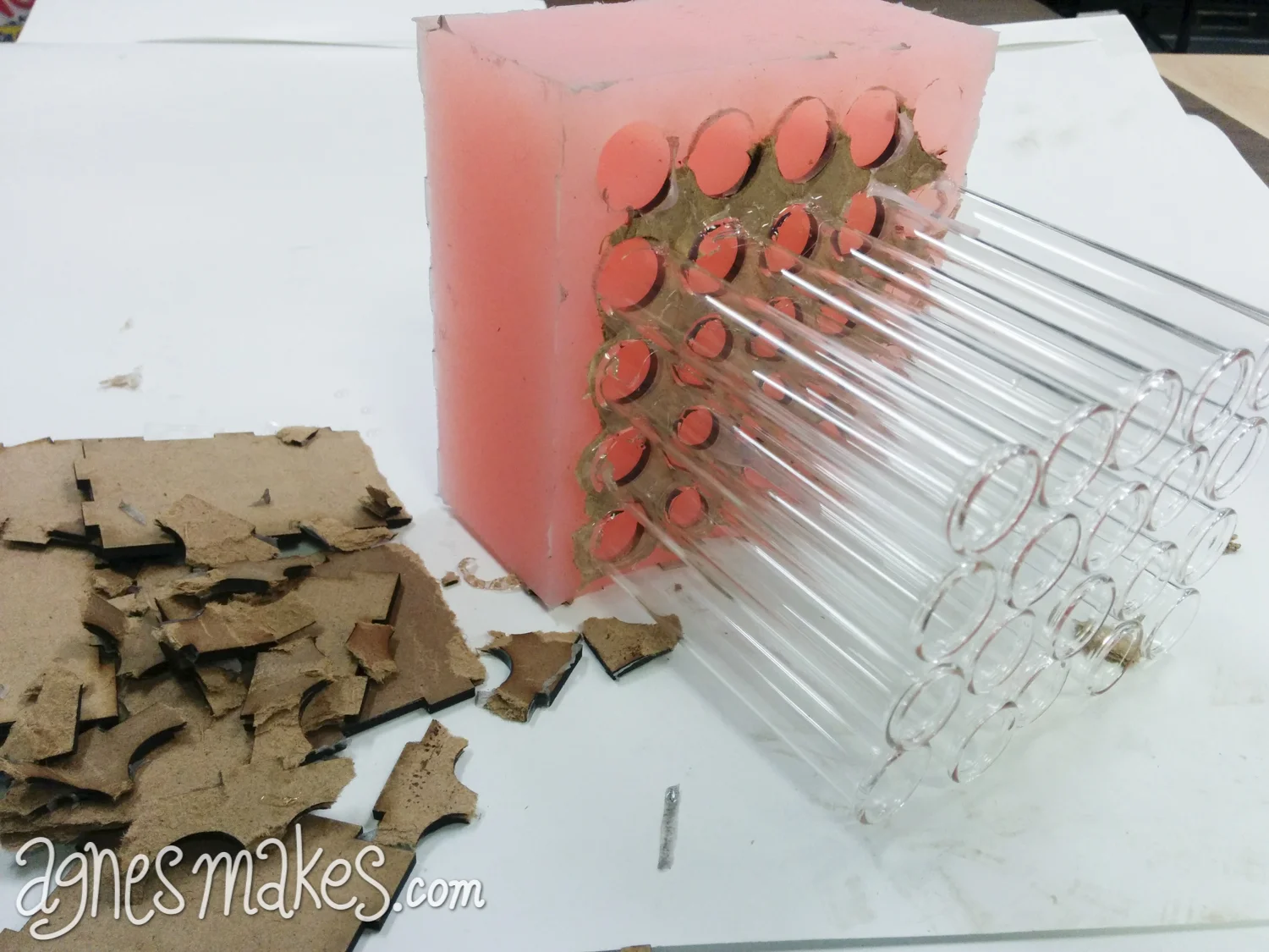 With the help of some needle nose pliers, and a lot of patience I was able to release the final part of the mother mold. As you can see it was meant for one time use only. Good thing hardboard is so cheap. The test tubes were cleaned and used again