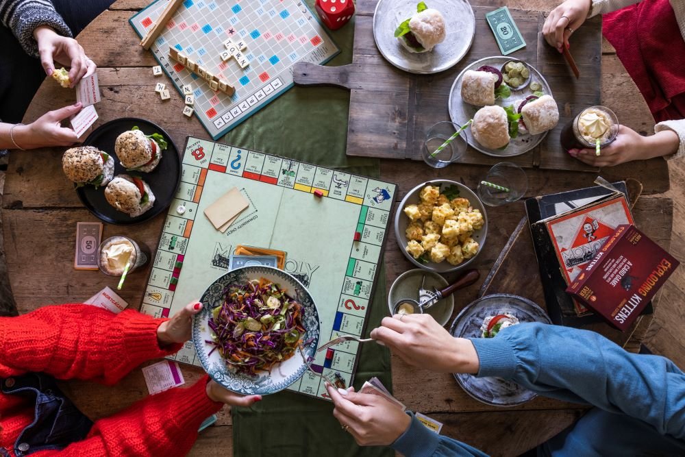 Red thermos next cup with hot chocolate with marshmallows on table with  snow outside Stock Photo - Alamy