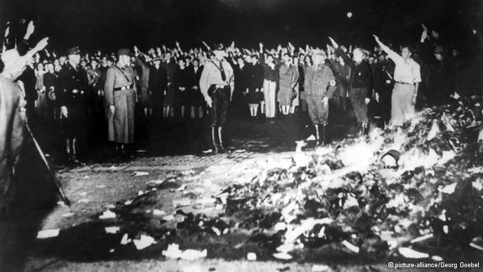 Nazis burning art and literature.