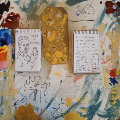 Notebooks with sketches and writings with studio detritus...