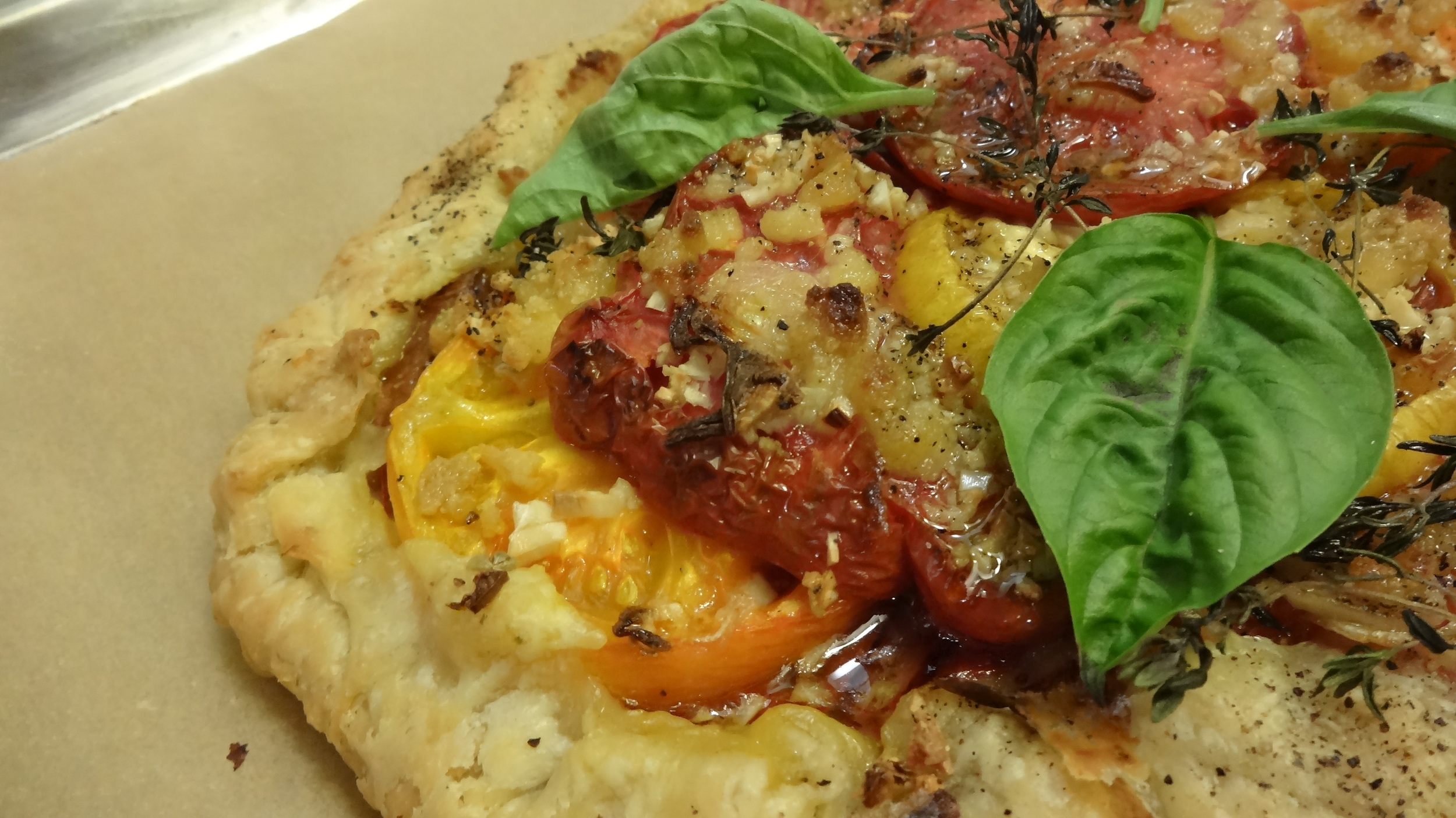 Local heirloom tomato galette is a perfect summertime treat--let me show you how easy and fun it can be to make!