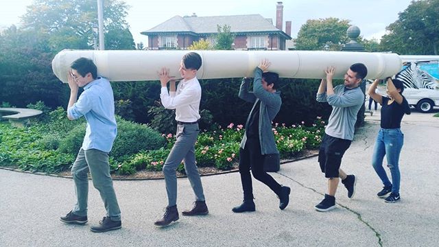 Installing with the help of UW Milwaukee #architecture students. It got really interesting when they charged this roll of #hotelcarpet up the stairway.