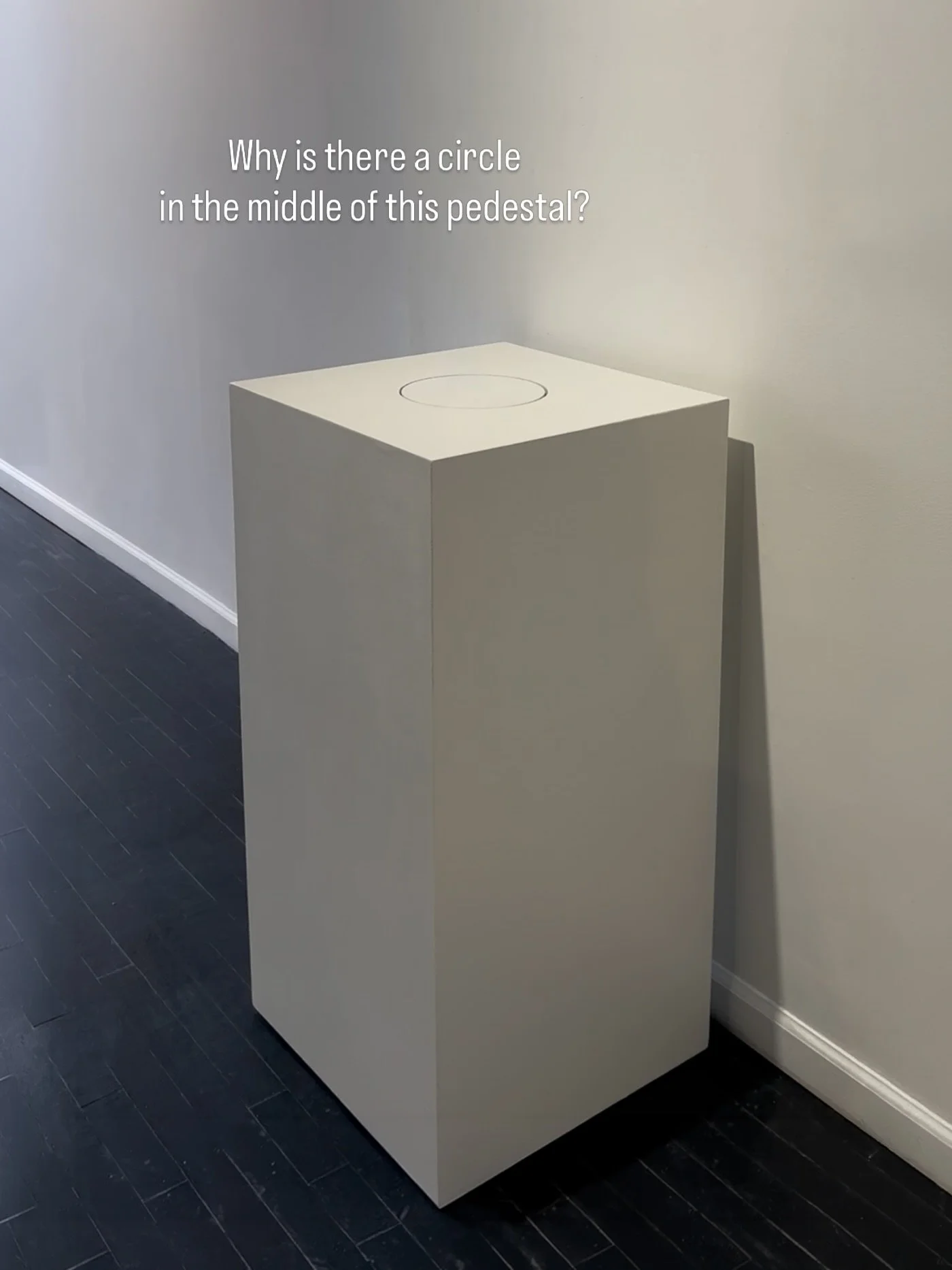 Marking the Center is a simple object: a pedestal with a door. But interacting with it forces a real decision: 
What deserves attention? 
What should be discarded? 
We make these judgments every waking moment. 
This piece takes that invisible process