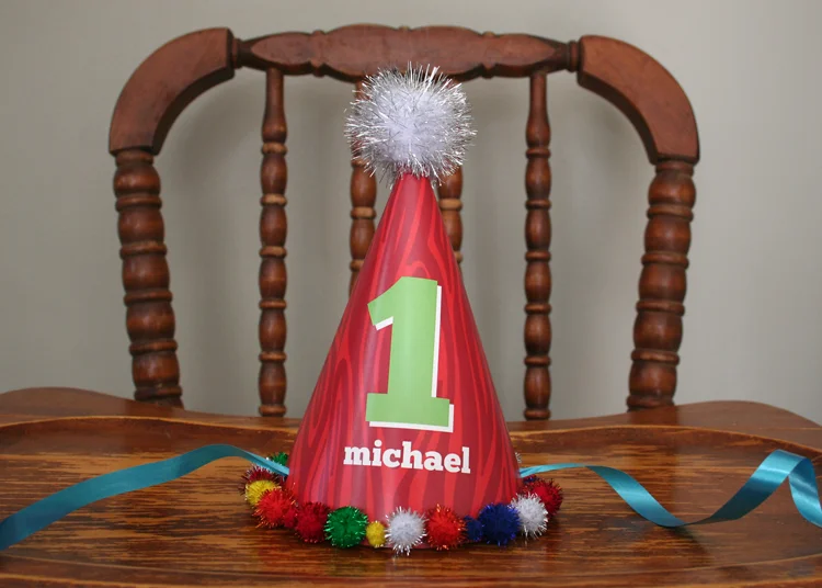 I even got my hot glue gun out for this party. (I had been dying to do so for way to long) Here is a handmade party hat that Michael was not so thrilled to wear. At least it looked cute on his highchair.
