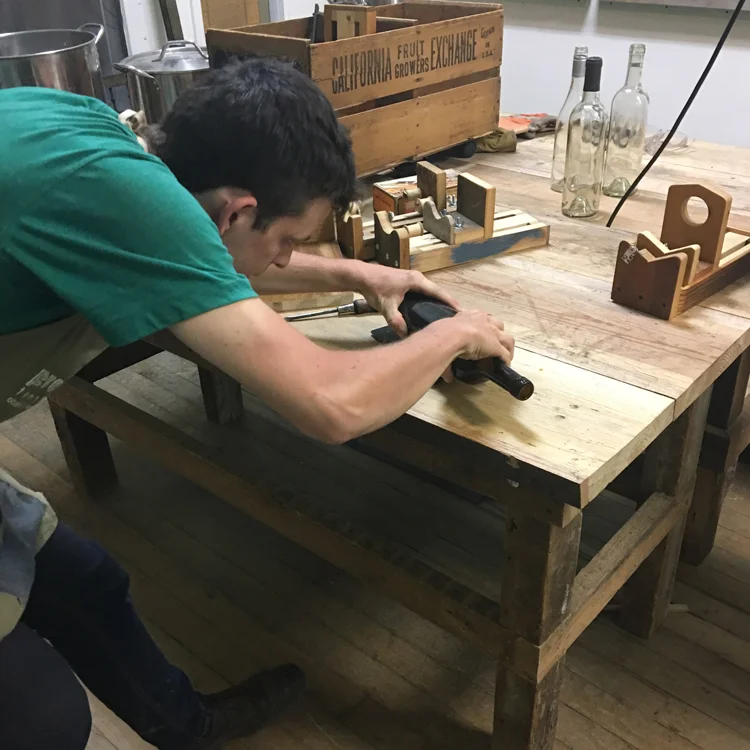 Here's the instructor, Ralph, showing us the ropes of "scoring" the bottles with their special tool.