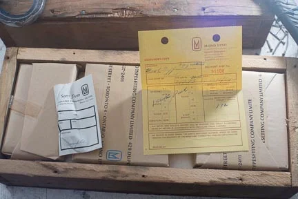 There were four crates like this one with new type never even opened. The packing slip was still inside, as was the sample font in the white envelope.