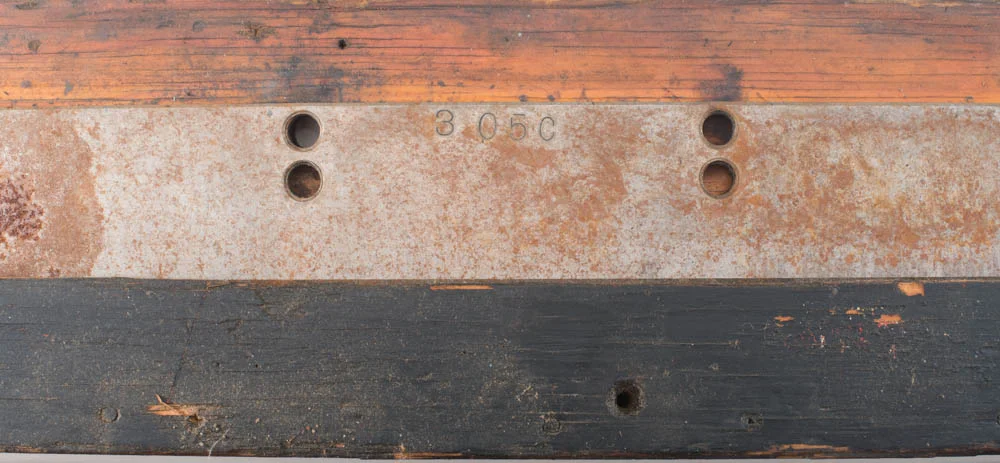 The cutter blade still bolted in the protective oiled wooden case just back from being sharpened.