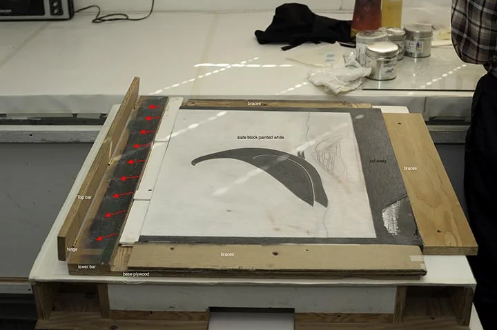 Detail: Top bar has the holes to receive the pins and is hinged to the bottom bar which is fixed and has the pins marked with red arrows.A detailed view below. You can see that the pins were sharpened with files in situ to suit the printers requirements.