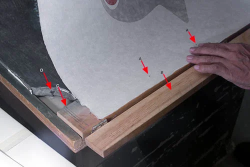 A are the pins that have just been pushed through the paper. B are the holes that receive the ins when the top bar is closed and secures the paper while printing. C are guide marks that the printer uses to orient the paper to the jig and the image. D is a wood screw used to secure the block to the base of the jig.