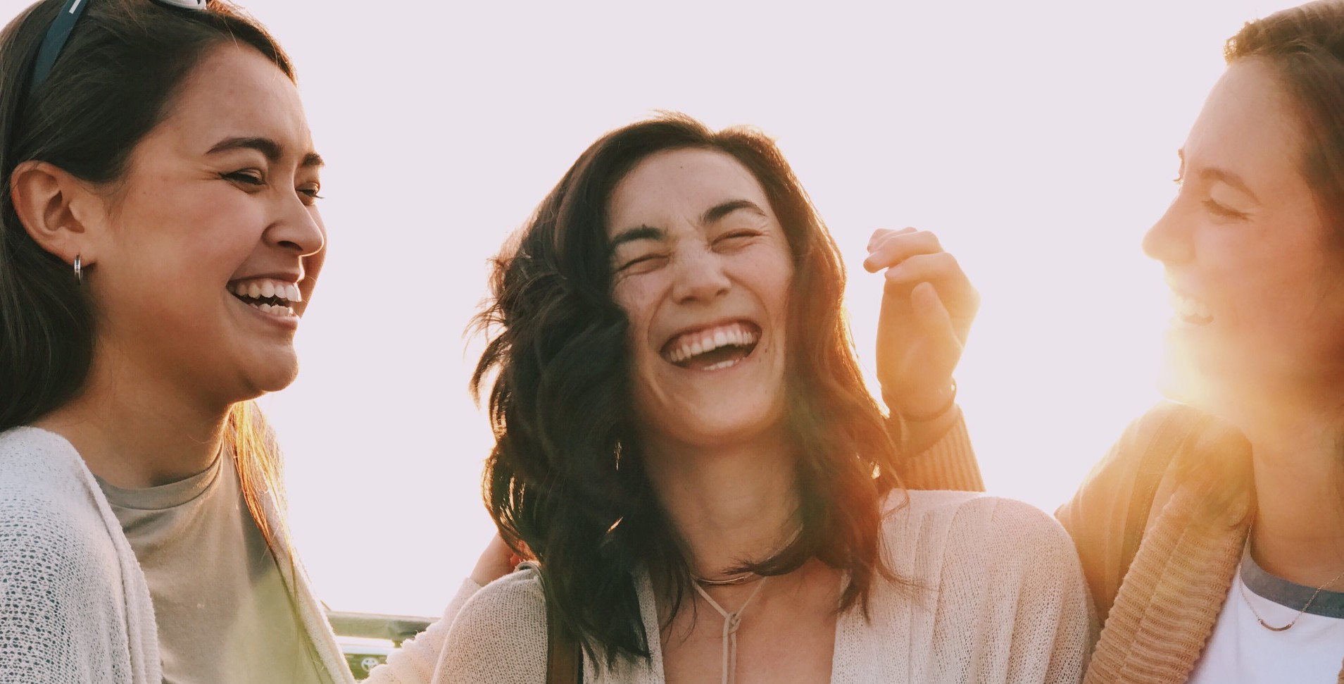 2millennial-women-friends-laughing-smiling-and-having-fun-at-golden-hour-sunset-at-venice-beach-in-in_t20_e8kO62.jpg