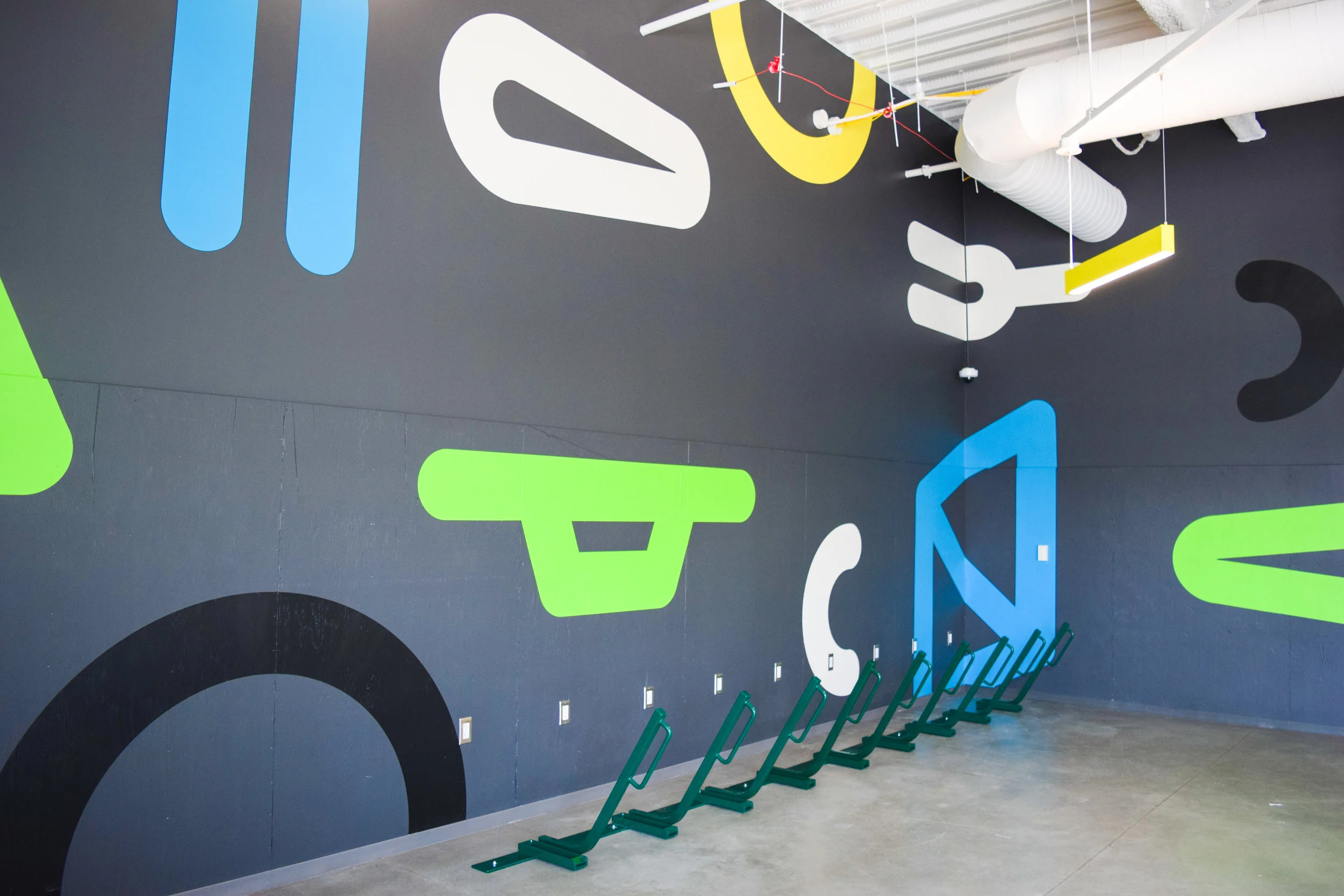 Design of hand-painted wall mural in secure bike storage