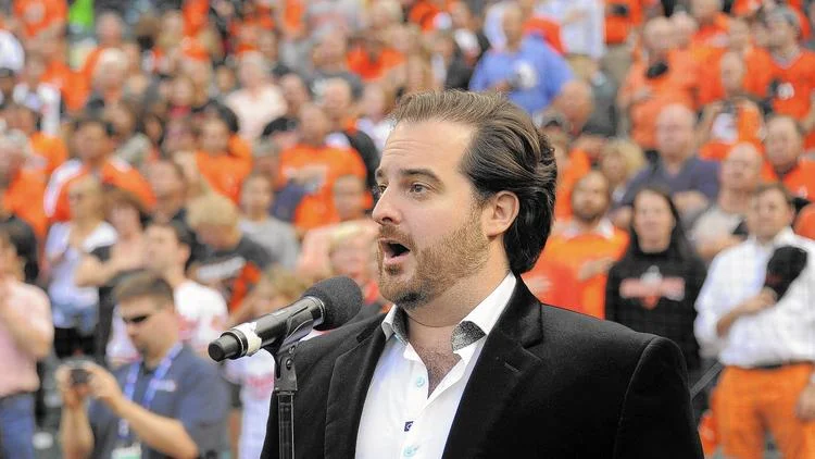 Rolando Sanz performs the National Anthem prior to Game 1 of the ALDS. (Karl Merton Ferron, Baltimore Sun)