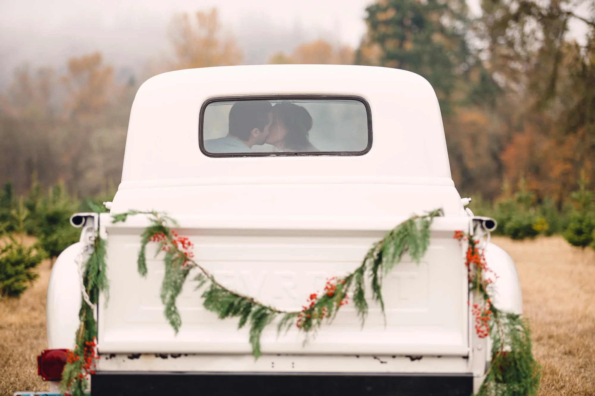 Vintage Chevy Truck Engagement Photos - Christmas Tree Farm Engagement Photos by Joshua Rainey Photography