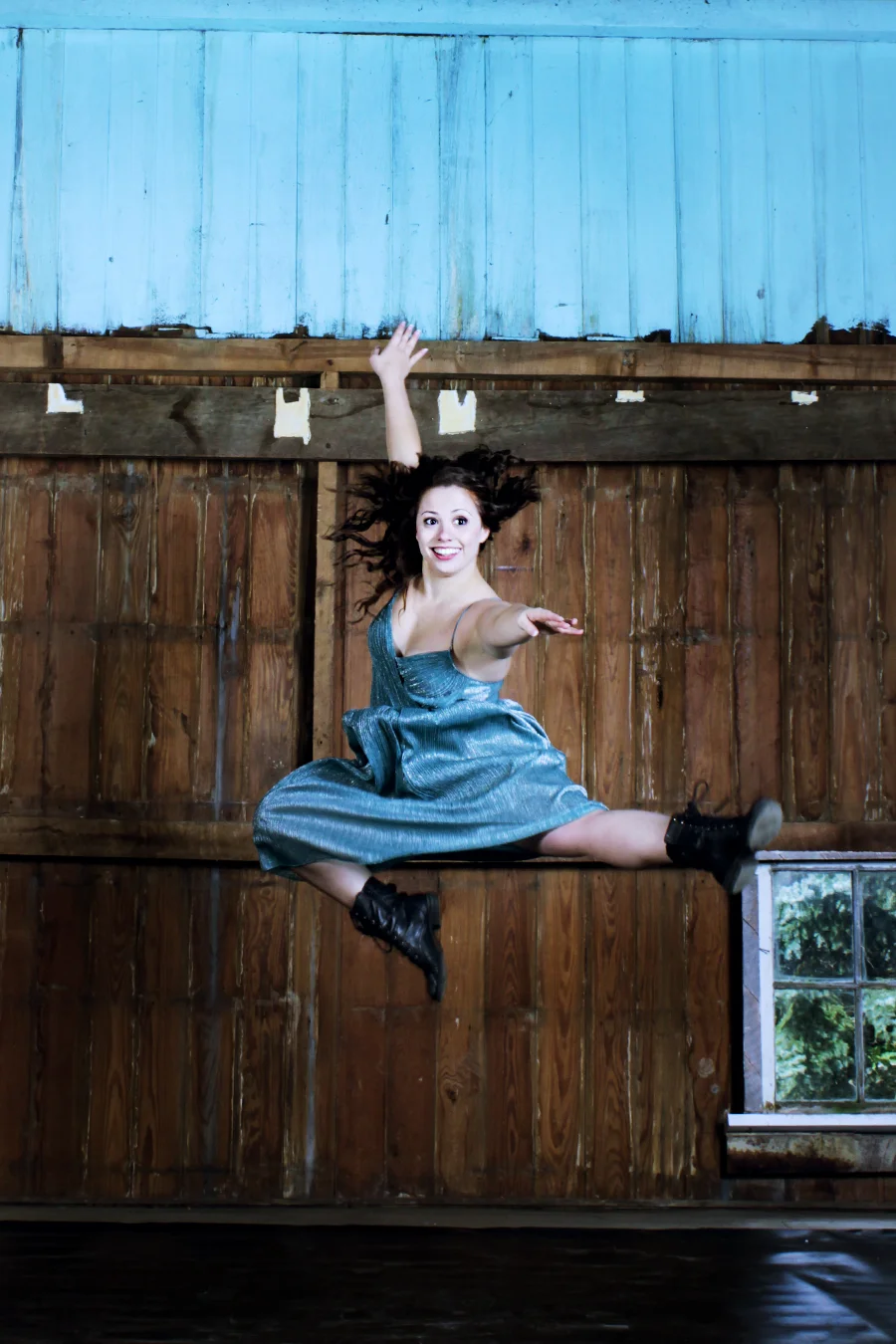 TMP's Megan Lee Gargano leaps in the company's barn space. Photo by Bryce Millikin.