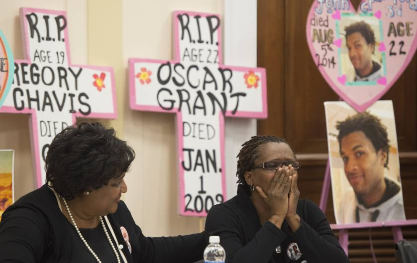 Collette Flanagan (L), mother of 25-year-old Clinton Allen who was shot and killed by a Dallas policeman, comforts Tressa Sherrod (R), mother of 22-year-old John Crawford III who was shot and killed by police in an Ohio Walmart, as they join other mothers who have lost children due to police action during a press conference calling for police accountability and reform on Capitol Hill in Washington, DC, December 10, 2014.