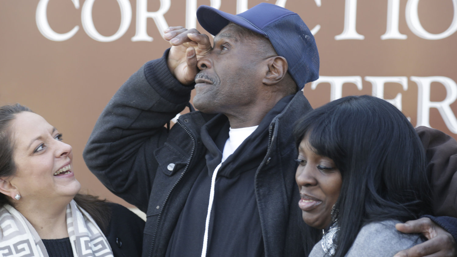 Stanley Wrice pauses in December 2013 as he speaks to the media with his lawyer, Heidi Linn Lambros (left), and his daughter, Gail Lewis, while leaving Pontiac Correctional Center in Pontiac, Ill. Wrice was released after serving more than 30 years. He claimed for decades that Chicago police detectives under the command of then-Lt. Jon Burge beat and coerced him into confessing to rape. M. Spencer Green/AP