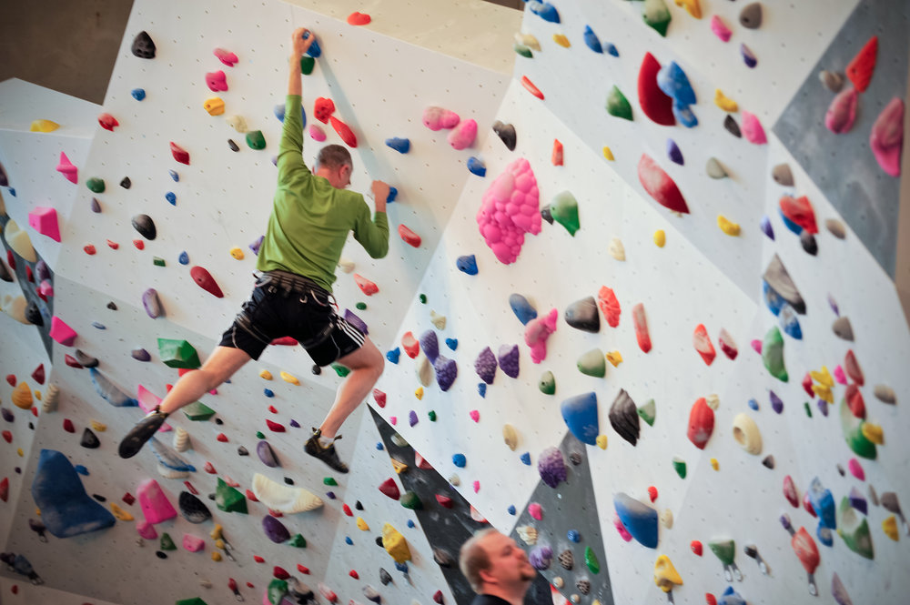 Bouldering (climbing without a rope) at CragX climbing gym in Victoria British Columbia. 